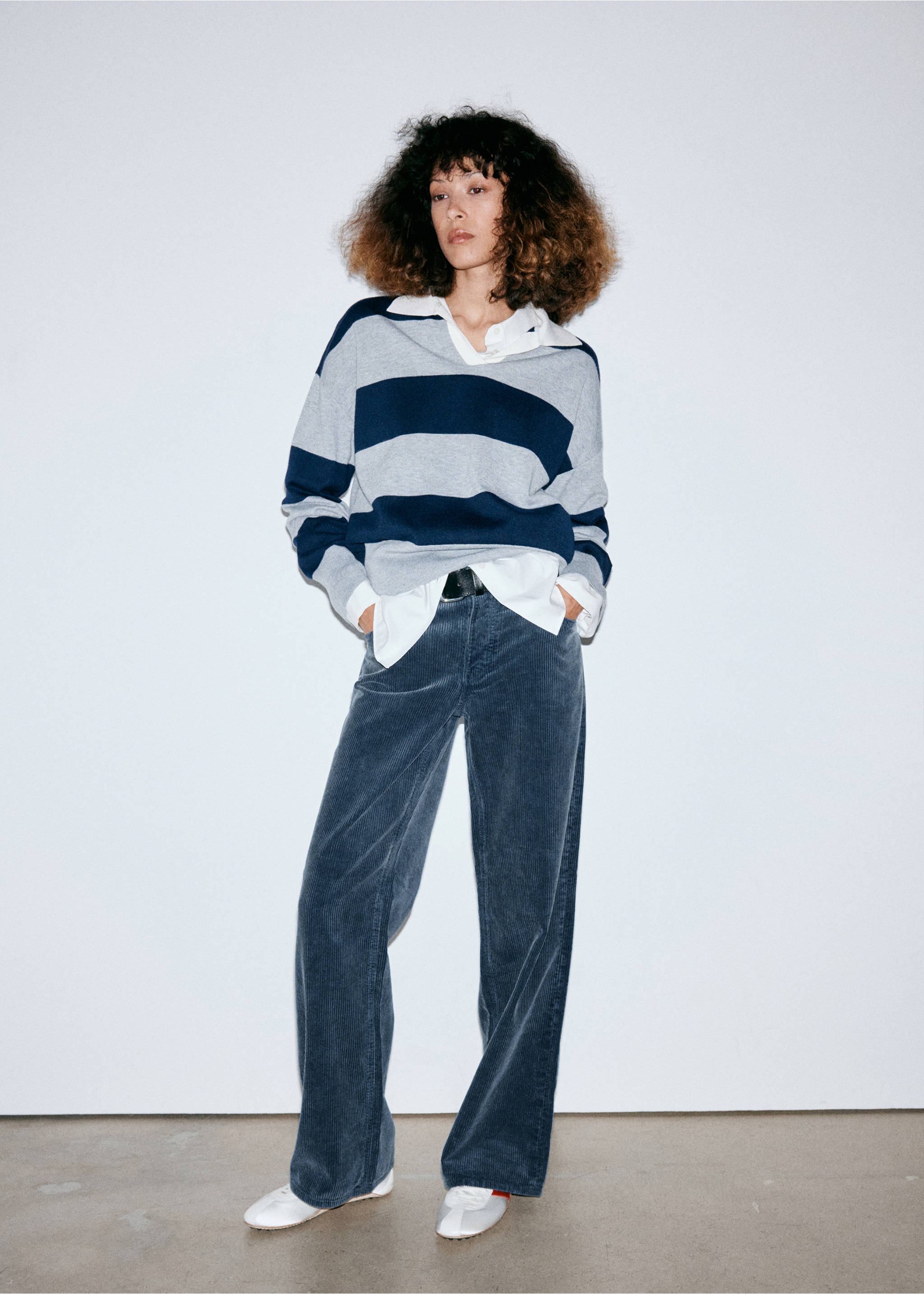 Blue corduroy trousers with a straight fit, worn with a striped sweater and white trainers., Blue. Ref: 37057780-01.