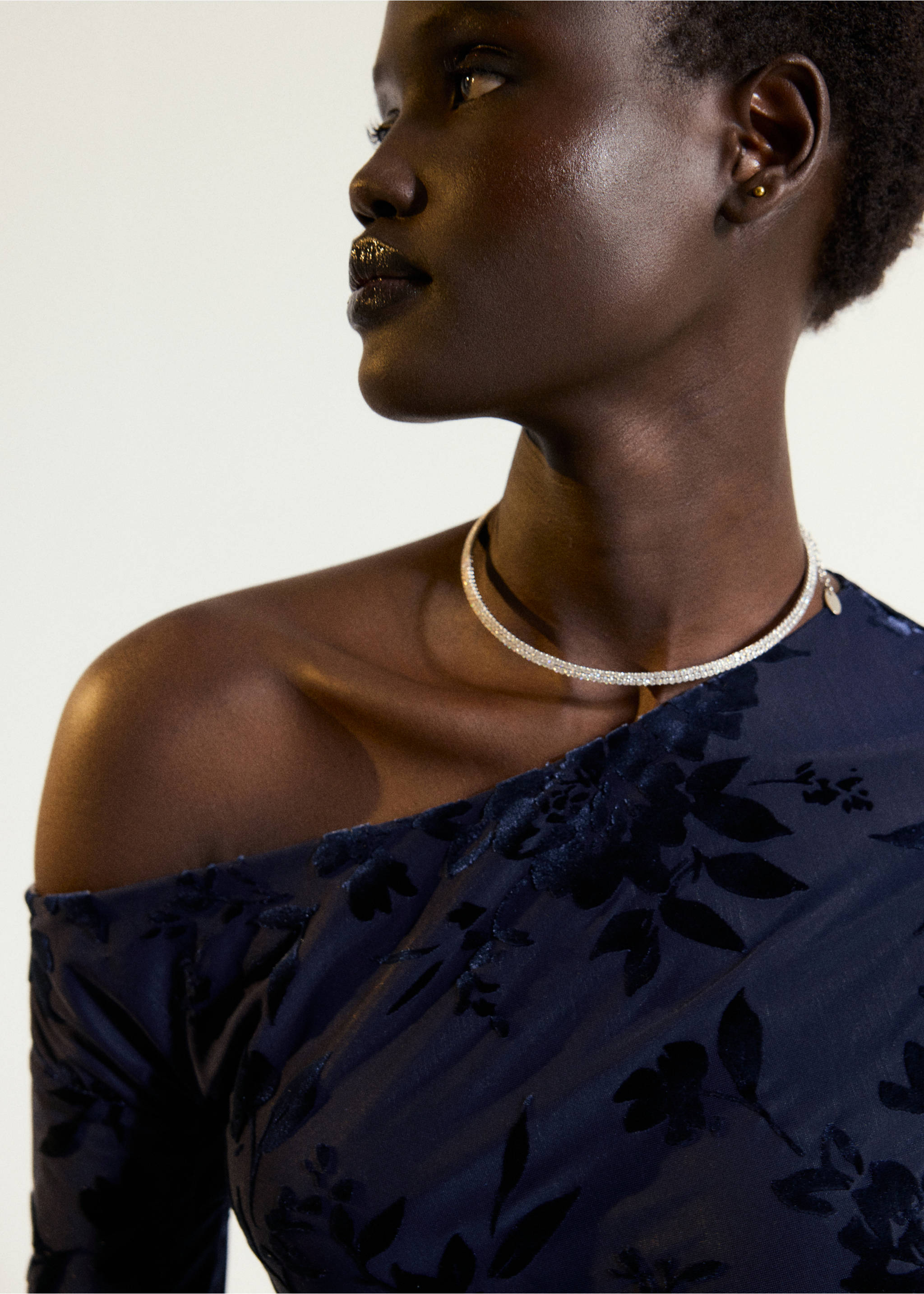 Close-up of a dark blue floral patterned dress with an asymmetric neckline., Navy. Ref: 37057791-00.