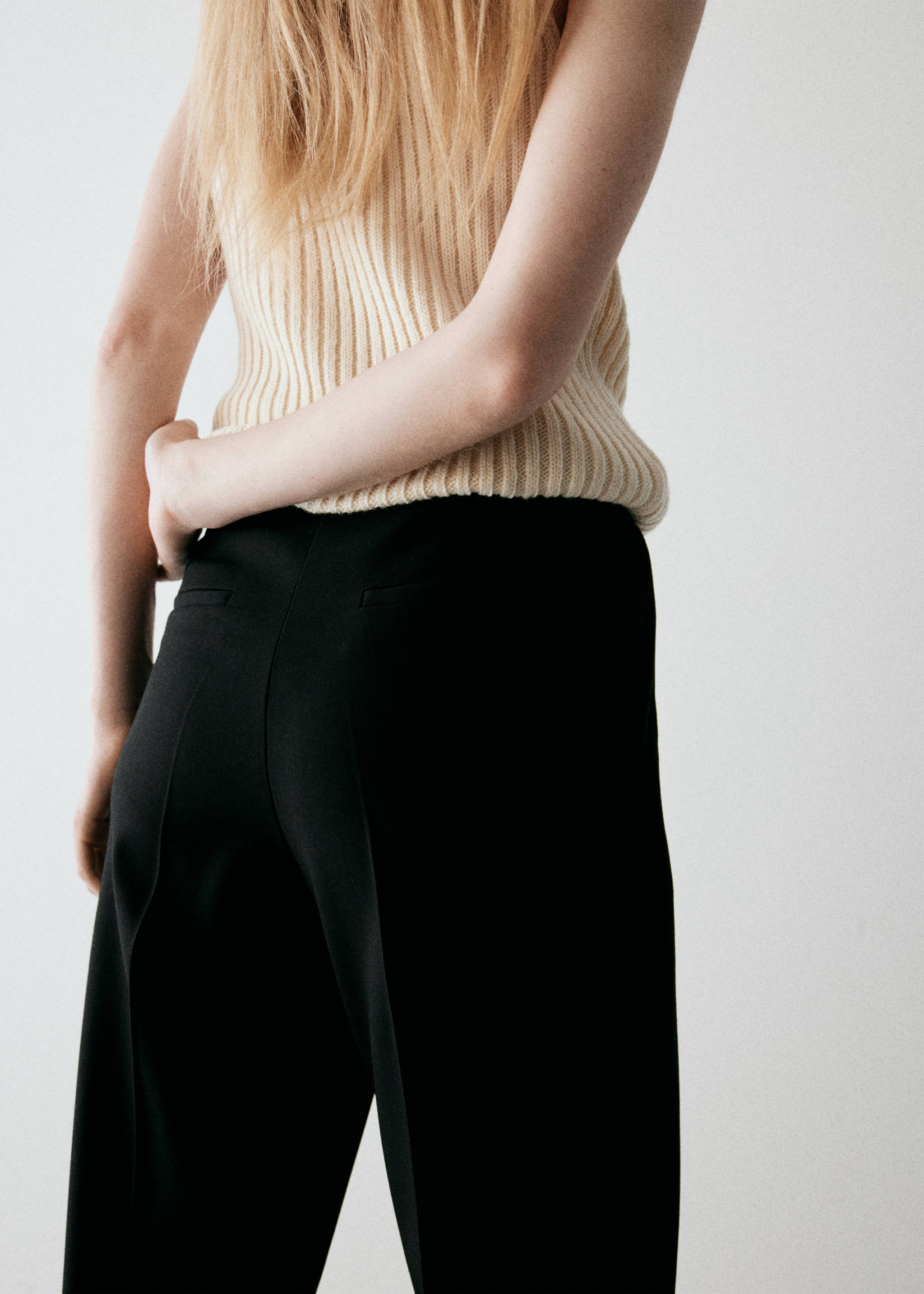 Flared trousers with pressed crease - Reverse of the article