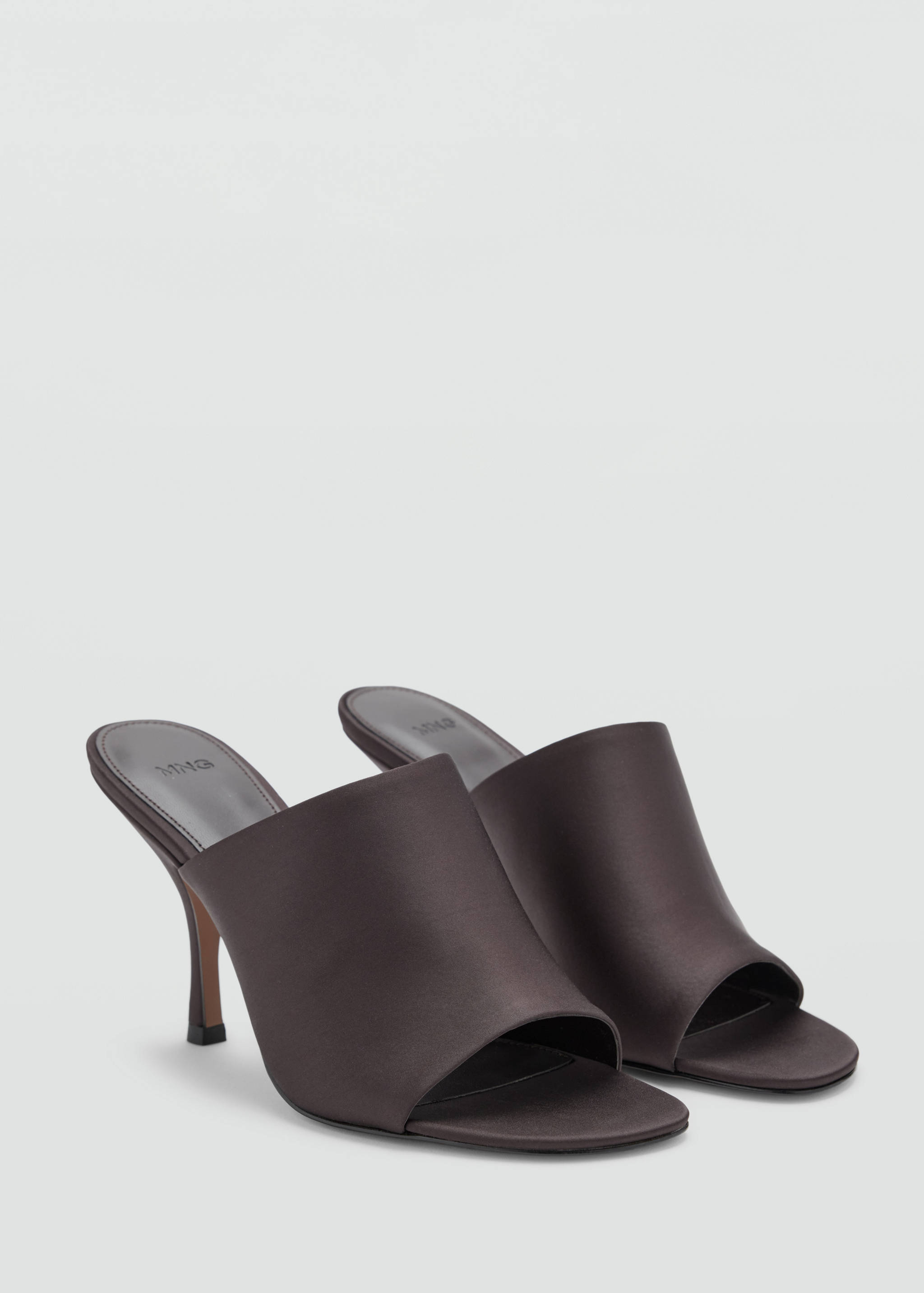 Dark brown satin heeled sandals in a three-quarter view with an open toe and stiletto heel.