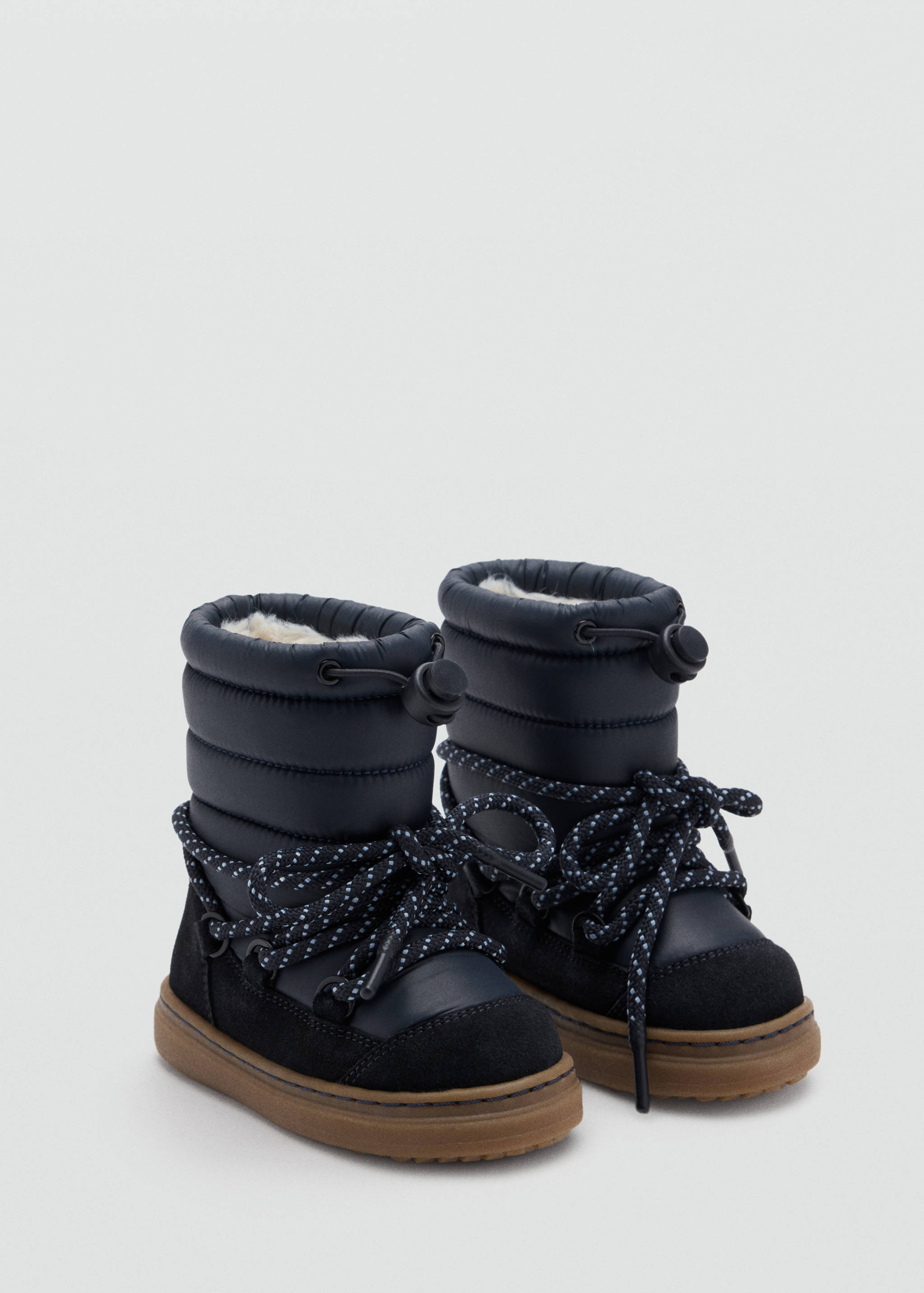 Navy blue quilted kids' snow boots with black suede panels and thick brown rubber soles.