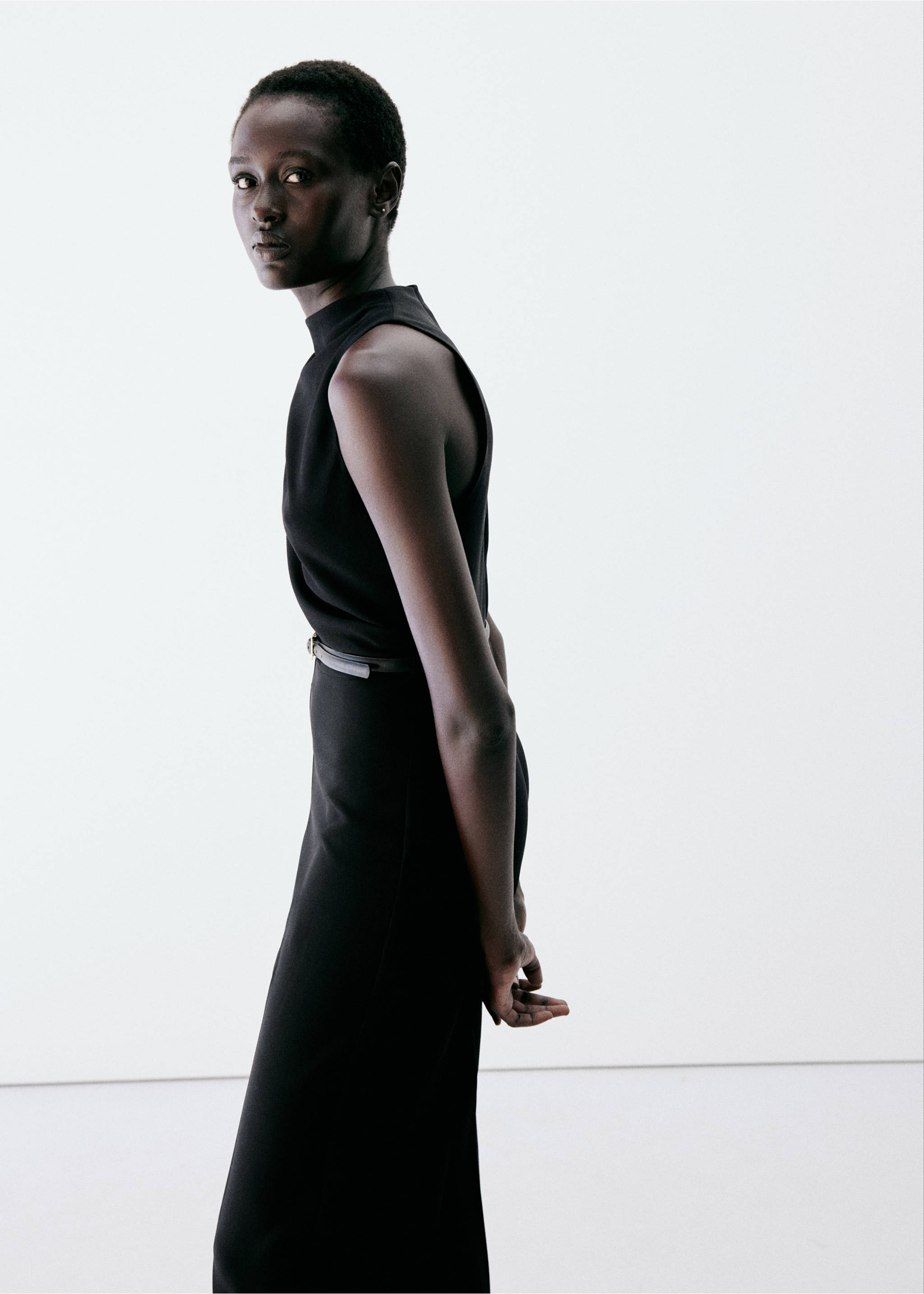 Black sleeveless jumpsuit with a high mock neckline., Black. Ref: 37057806-00.