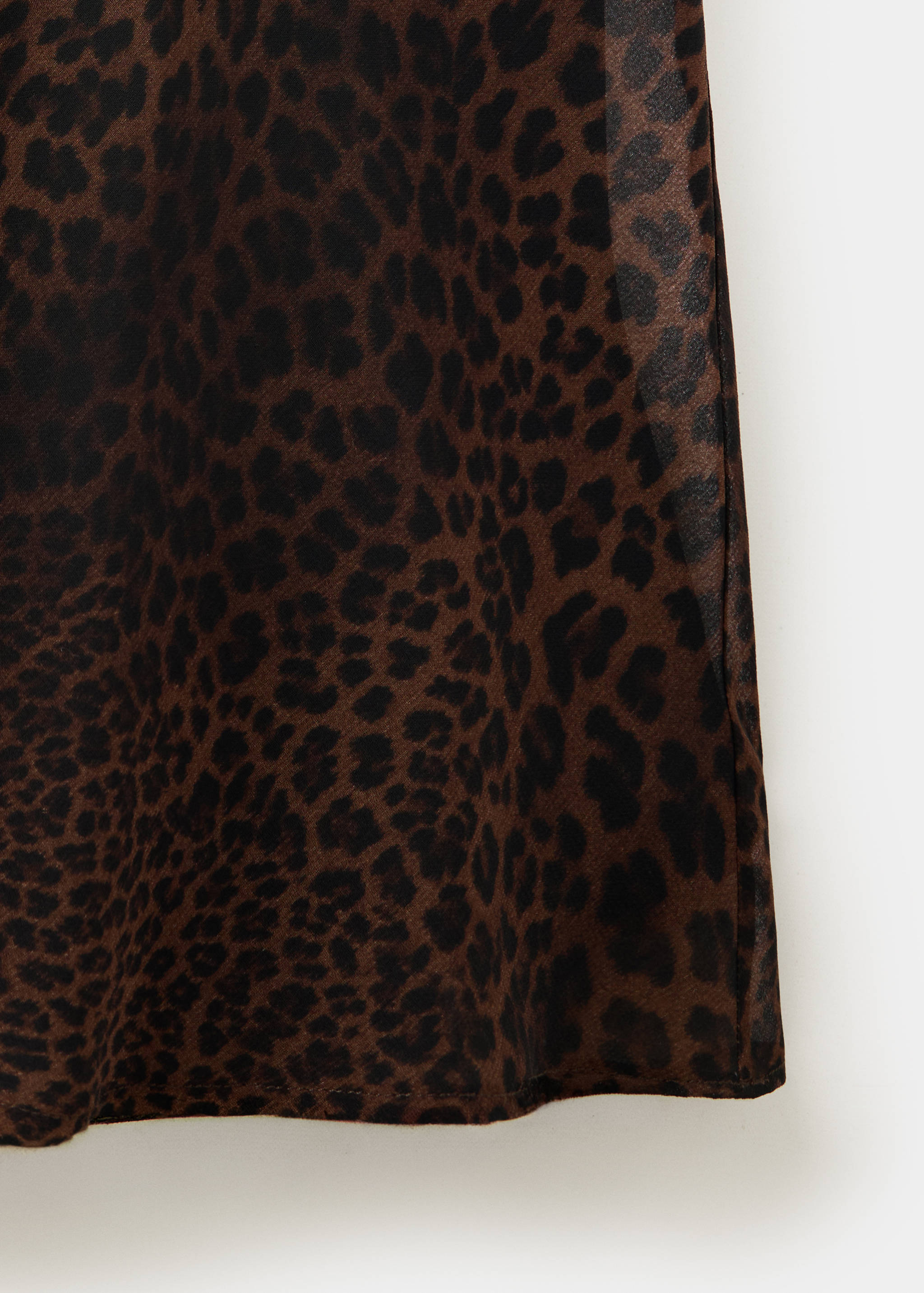 Close-up of a brown leopard print dress fabric.
