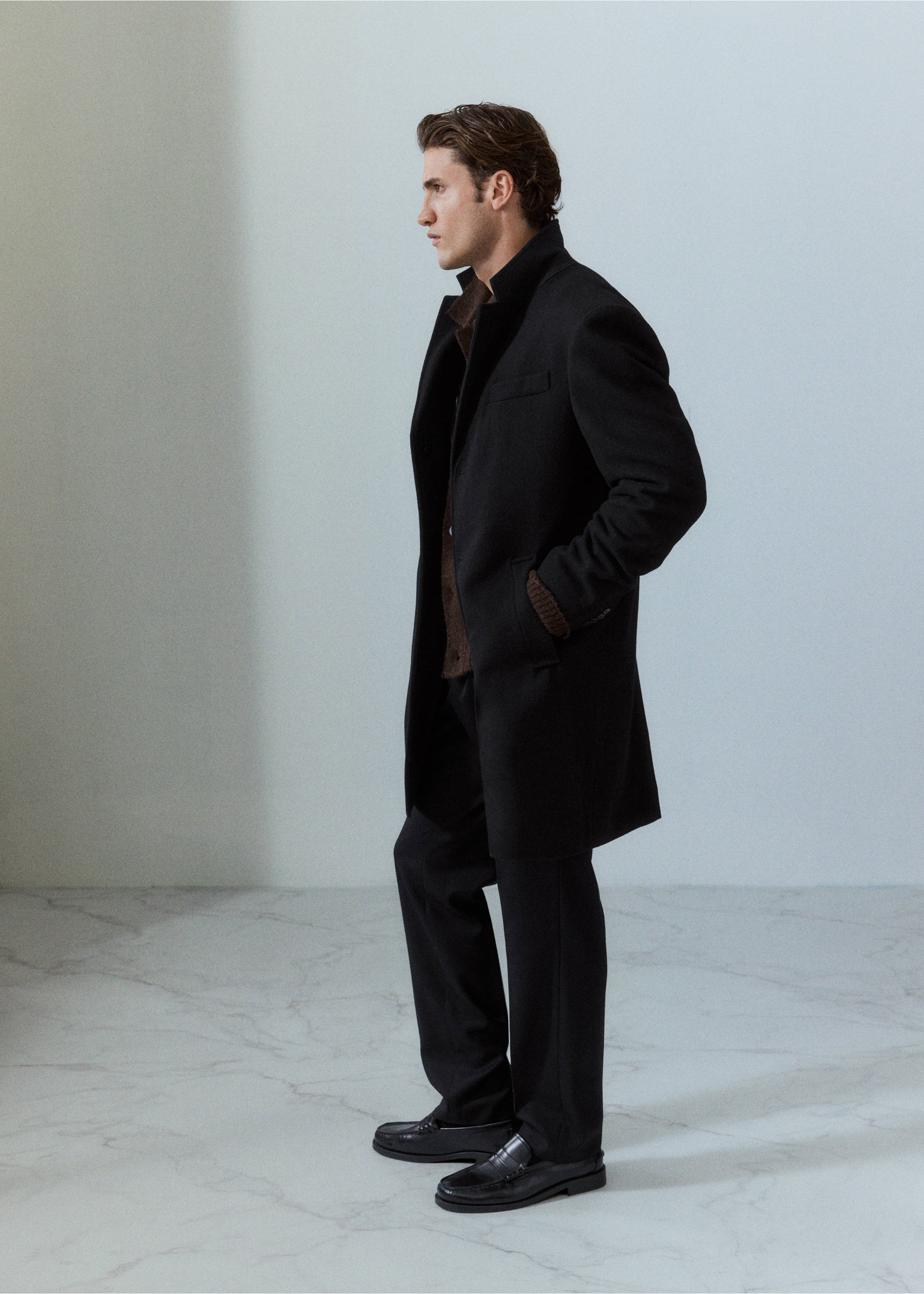 Black coat with a standing collar and pockets, Black. Ref: 37057883-00.