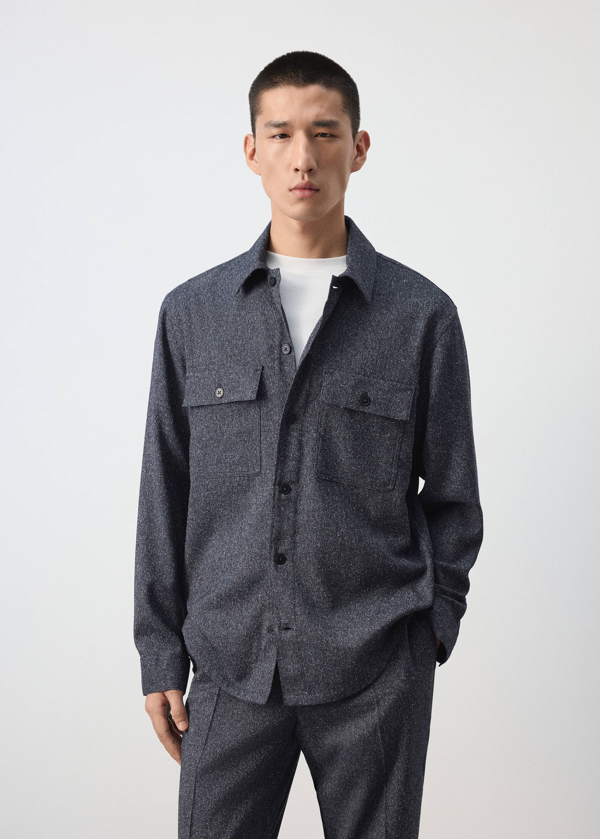 Dark grey melange overshirt with buttoned chest pockets.
