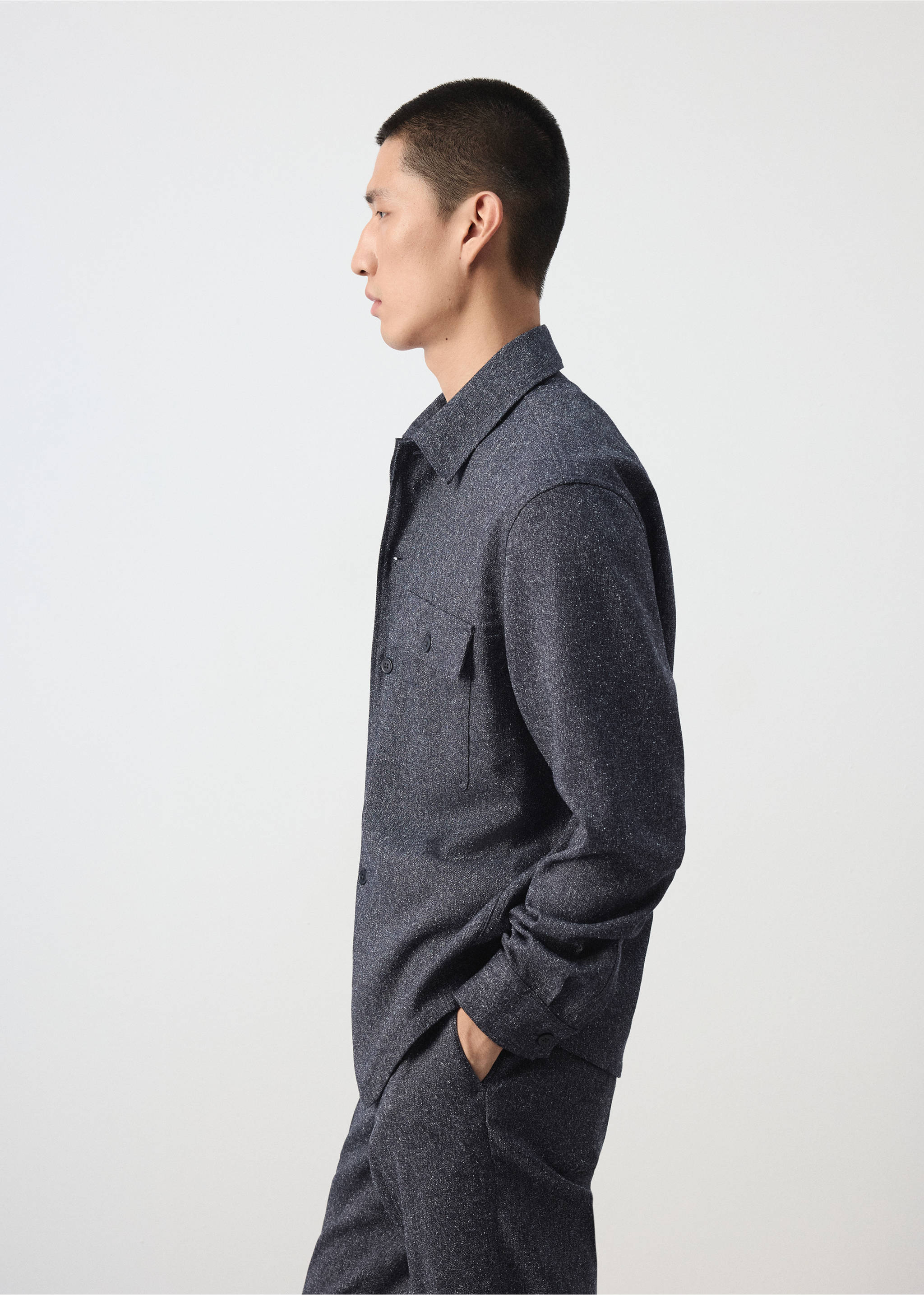 Dark grey speckled overshirt with a classic collar and chest pocket, shown in profile view., Blue. Ref: 37057885-00.