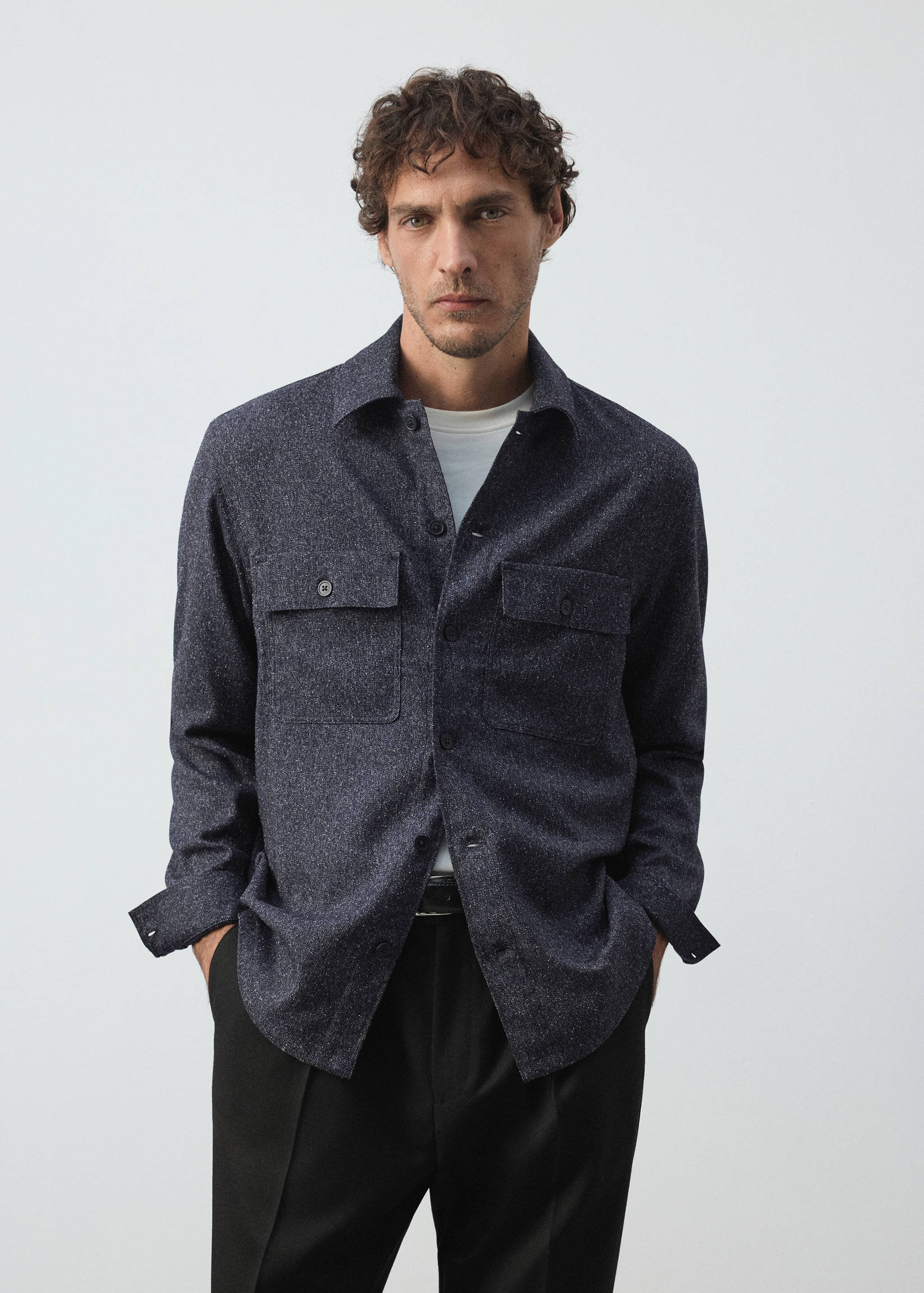 Navy blue textured overshirt with a classic collar and chest pockets.
