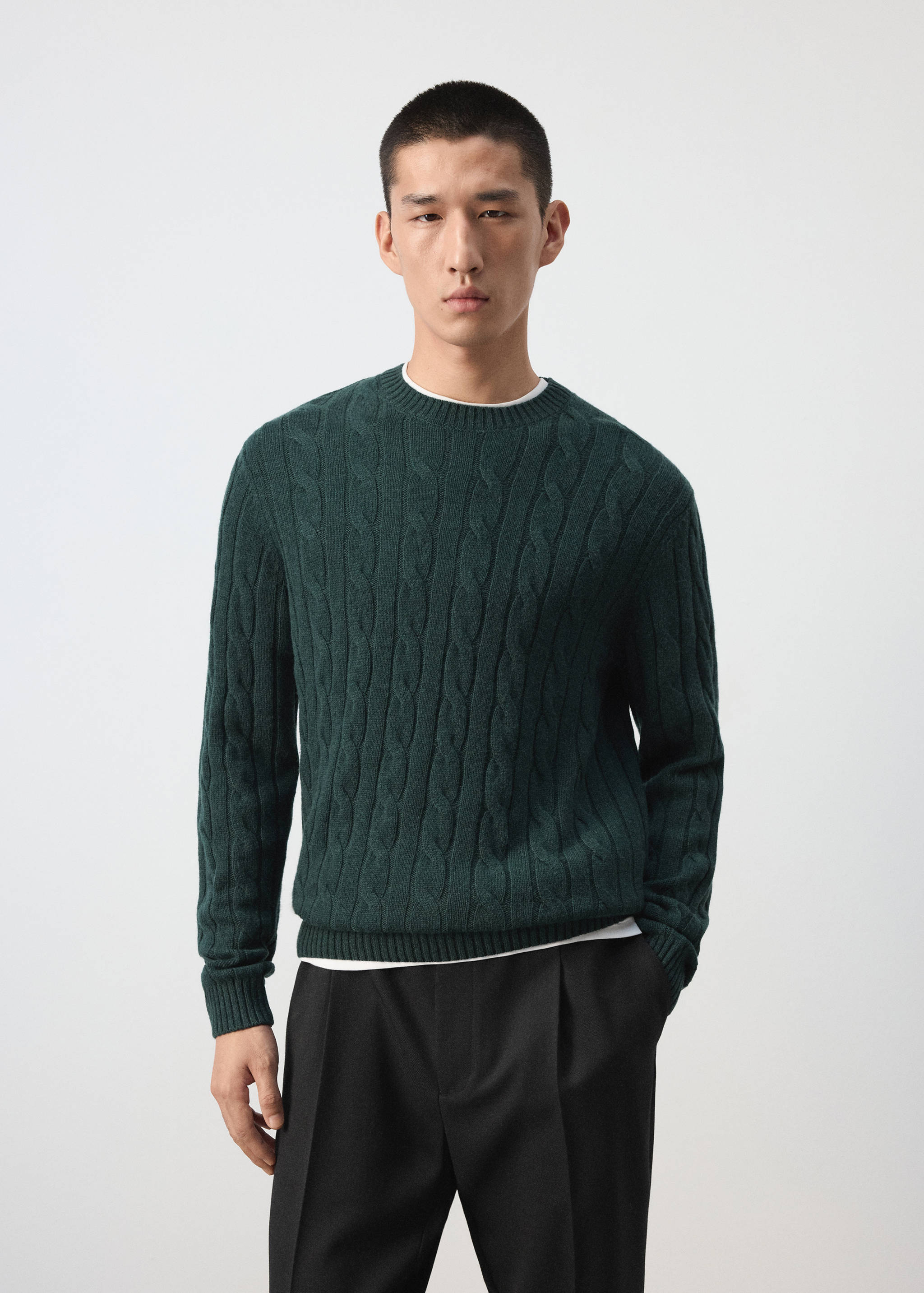 Dark green cable-knit crew-neck jumper with ribbed trims.