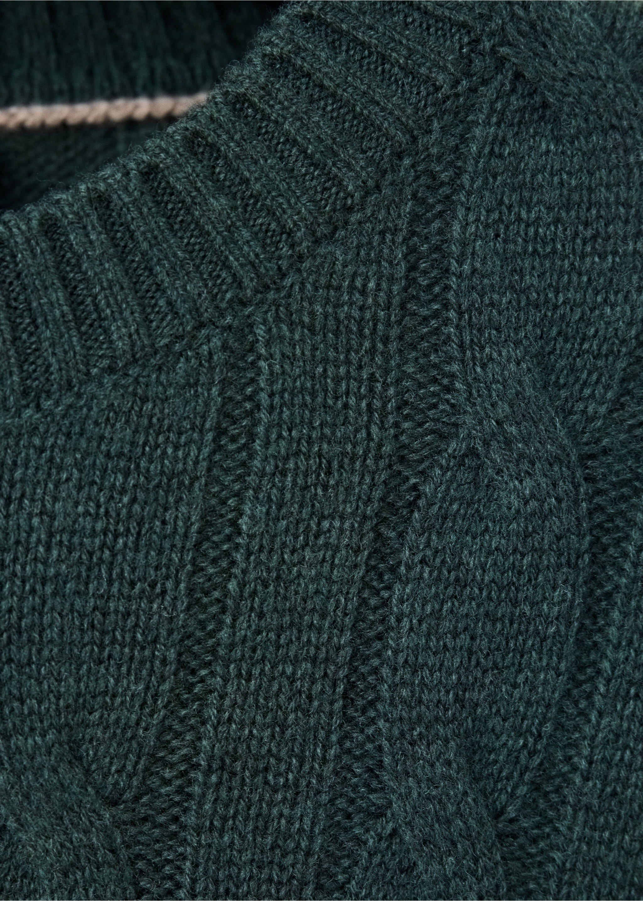Close-up of a dark green cable-knit sweater neckline., Dark Green. Ref: 37057886-00.