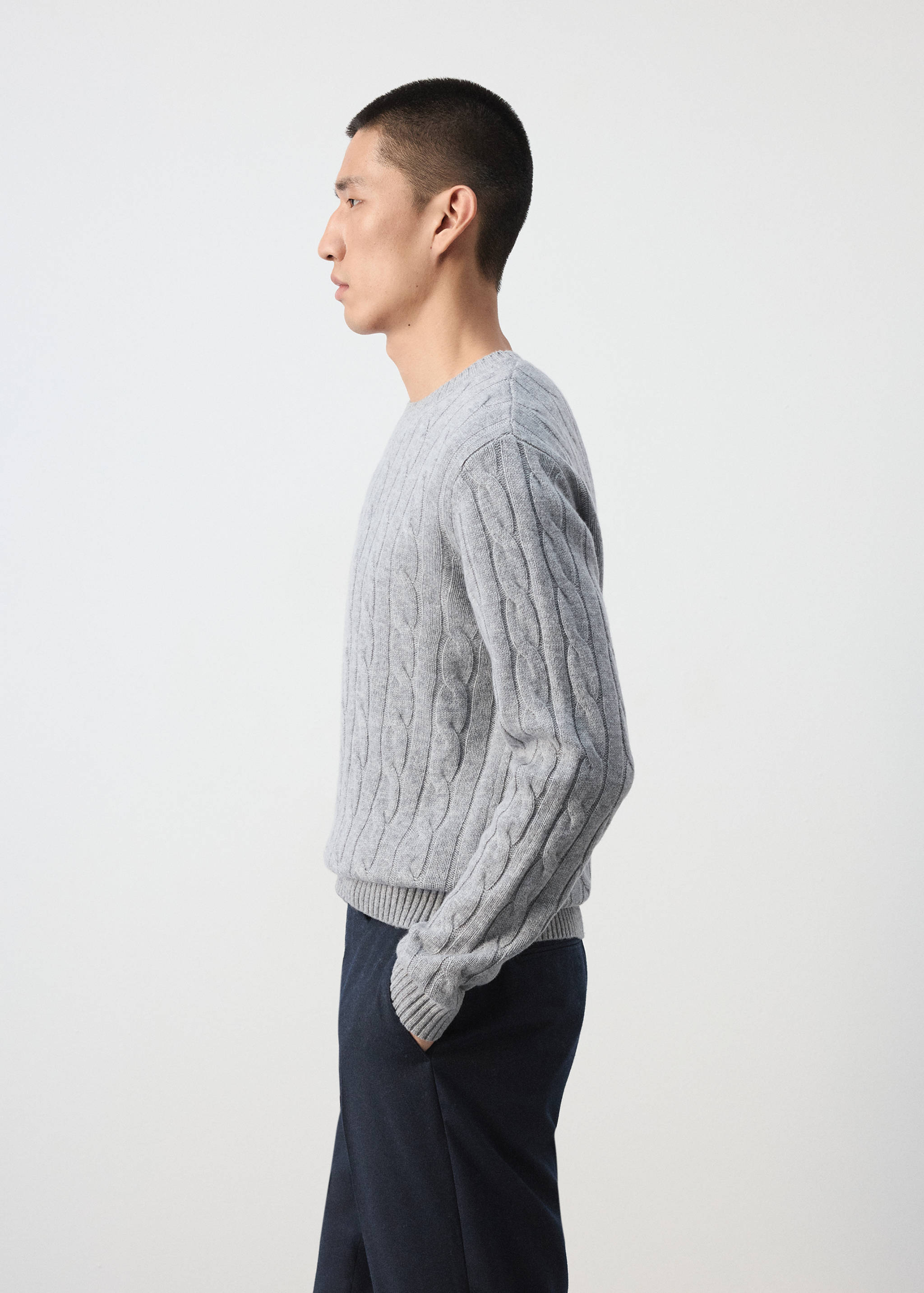 Grey cable-knit jersey with a crew neck and ribbed trims.
