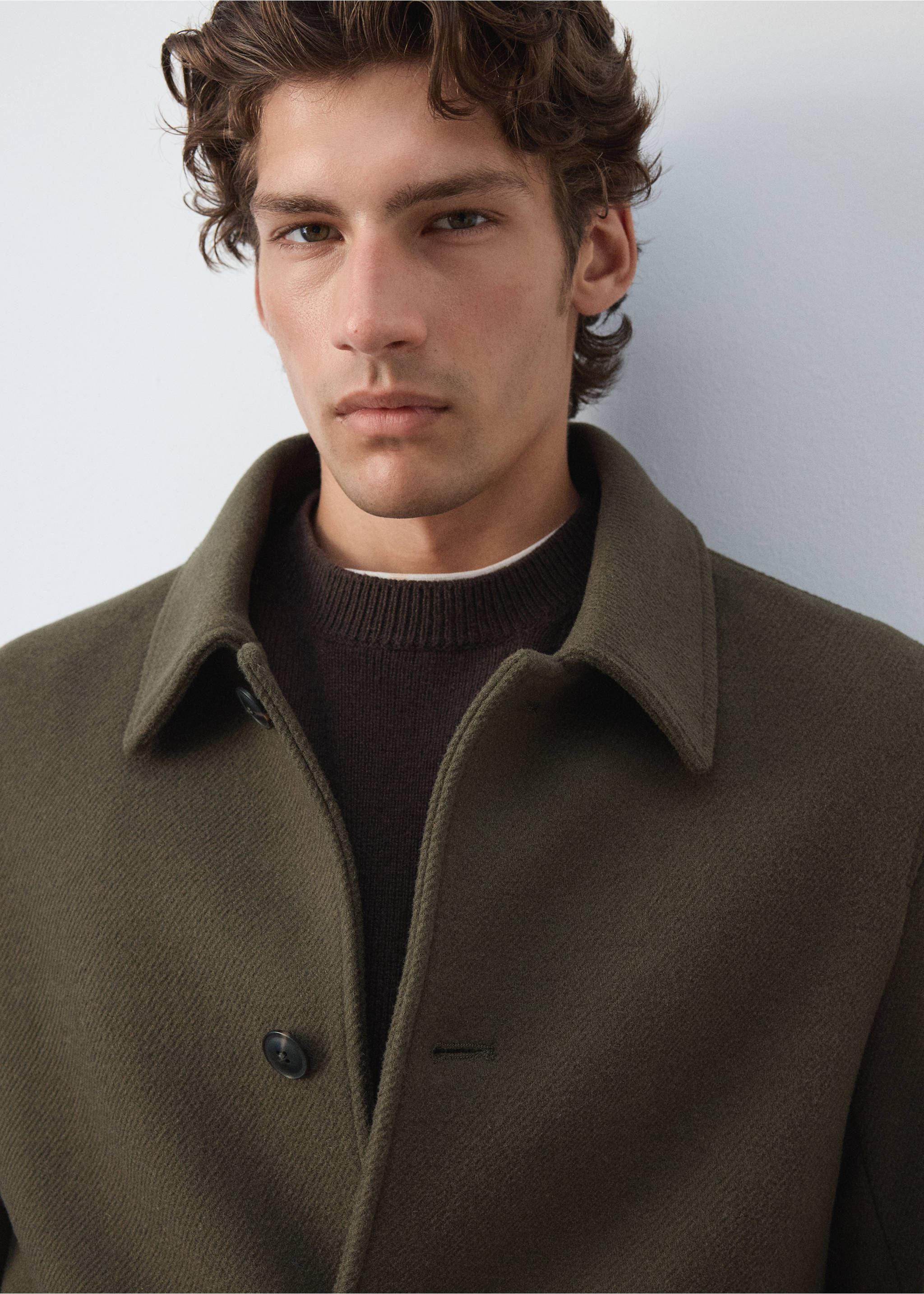 Close-up of an olive green coat with a shirt collar and dark buttons., Medium Brown. Ref: 37057888-00.