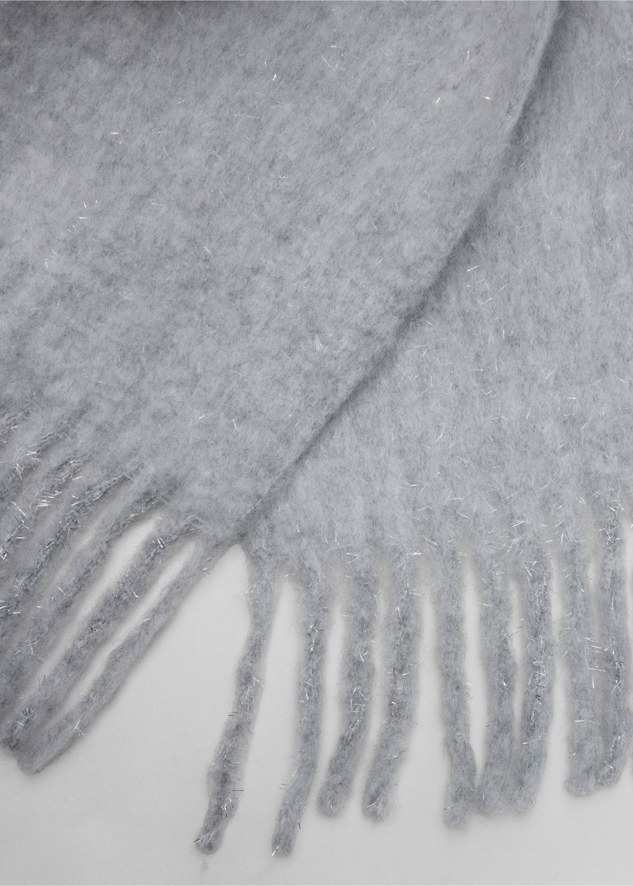 Close-up of a light grey scarf with soft texture and fringe trim., Grey. Ref: 37057896-00.