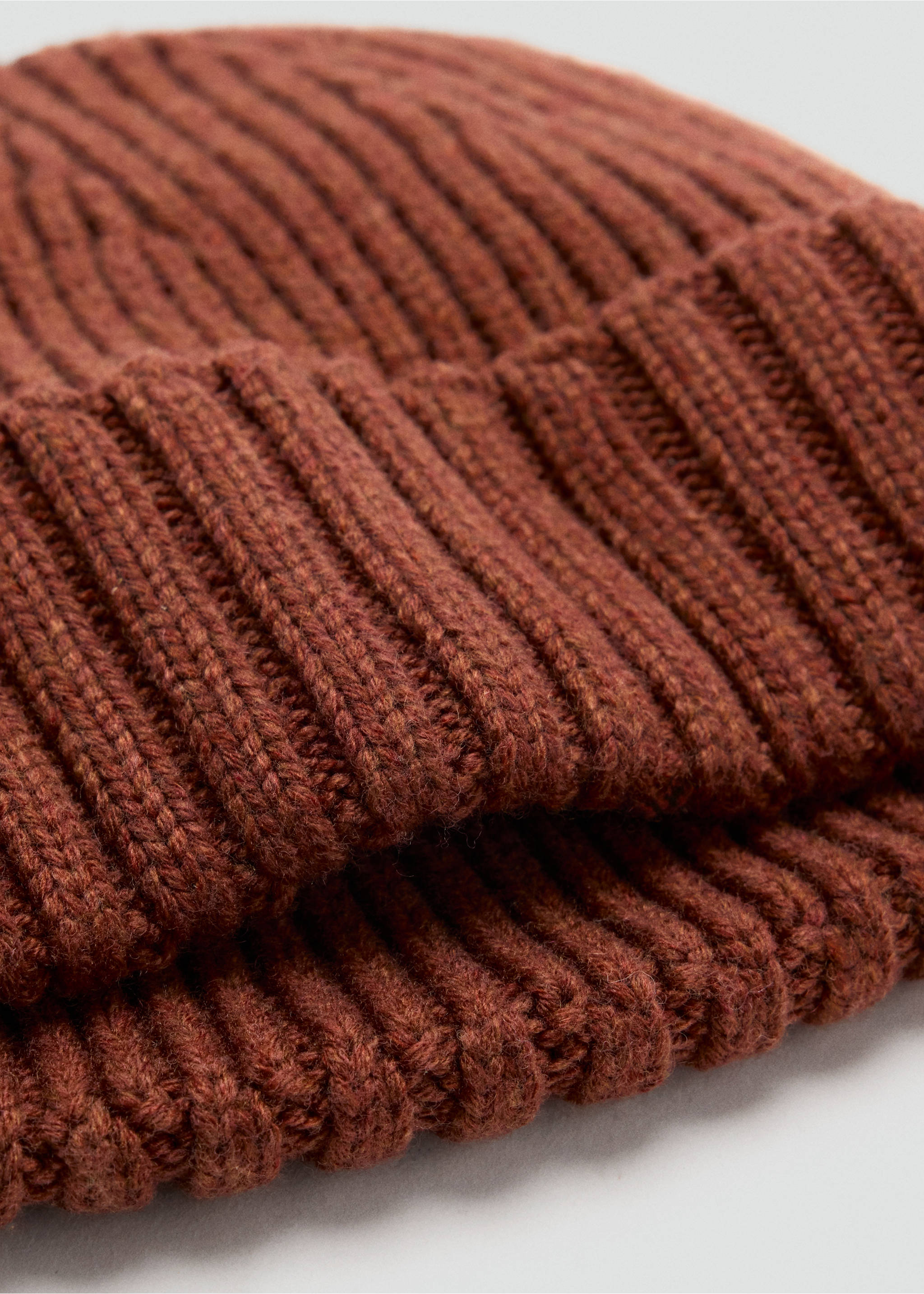 Dark brown ribbed knit beanie with a folded cuff in close-up., Burnt Orange. Ref: 37057902-00.