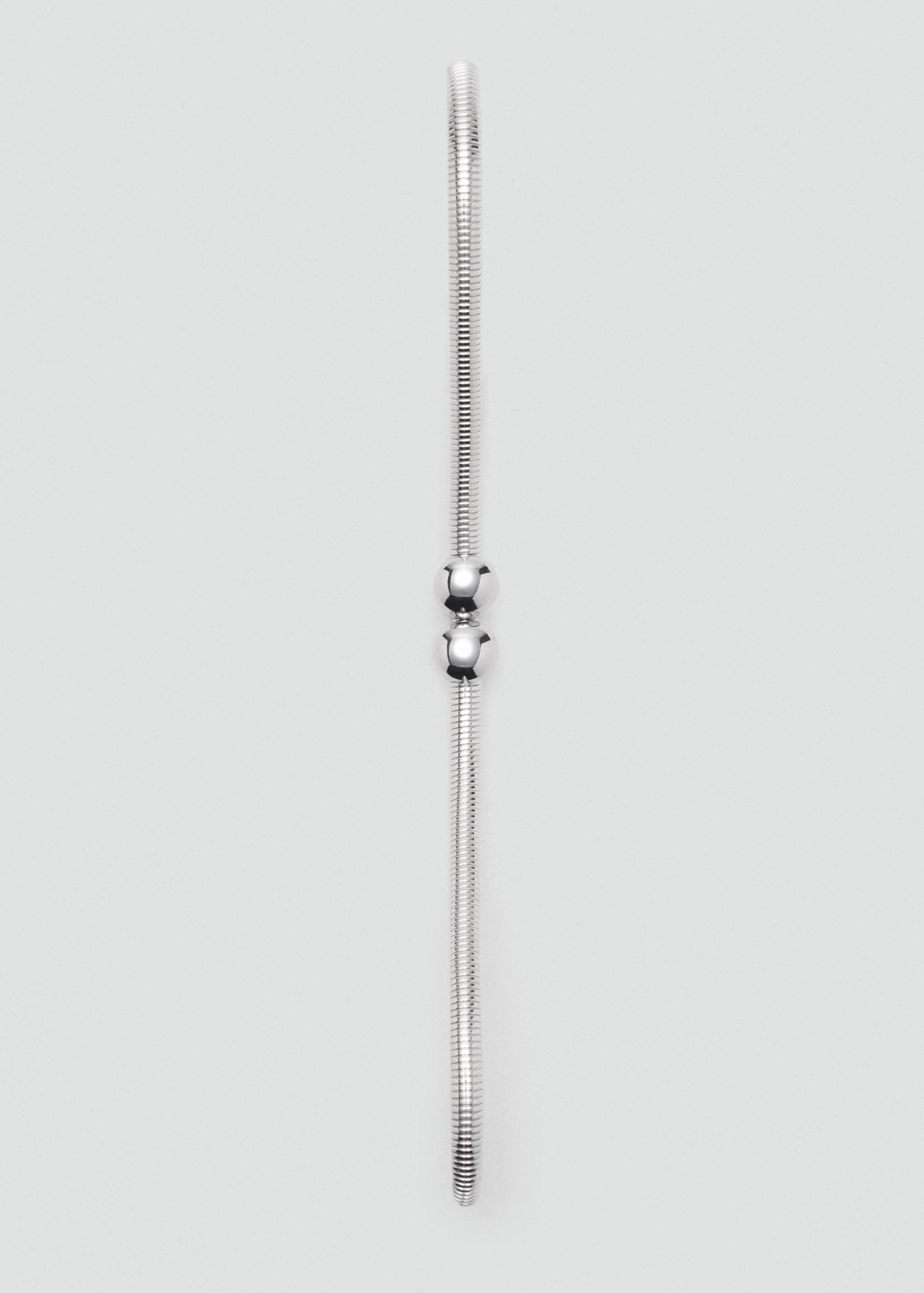 Silver metallic belt with ribbed tubular design and central spherical ball details.