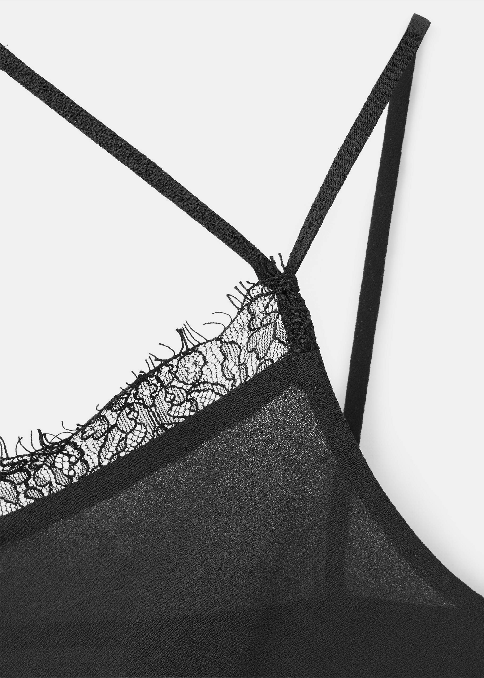 Close-up of a black top with delicate straps and lace trim., Black. Ref: 37057910-00.