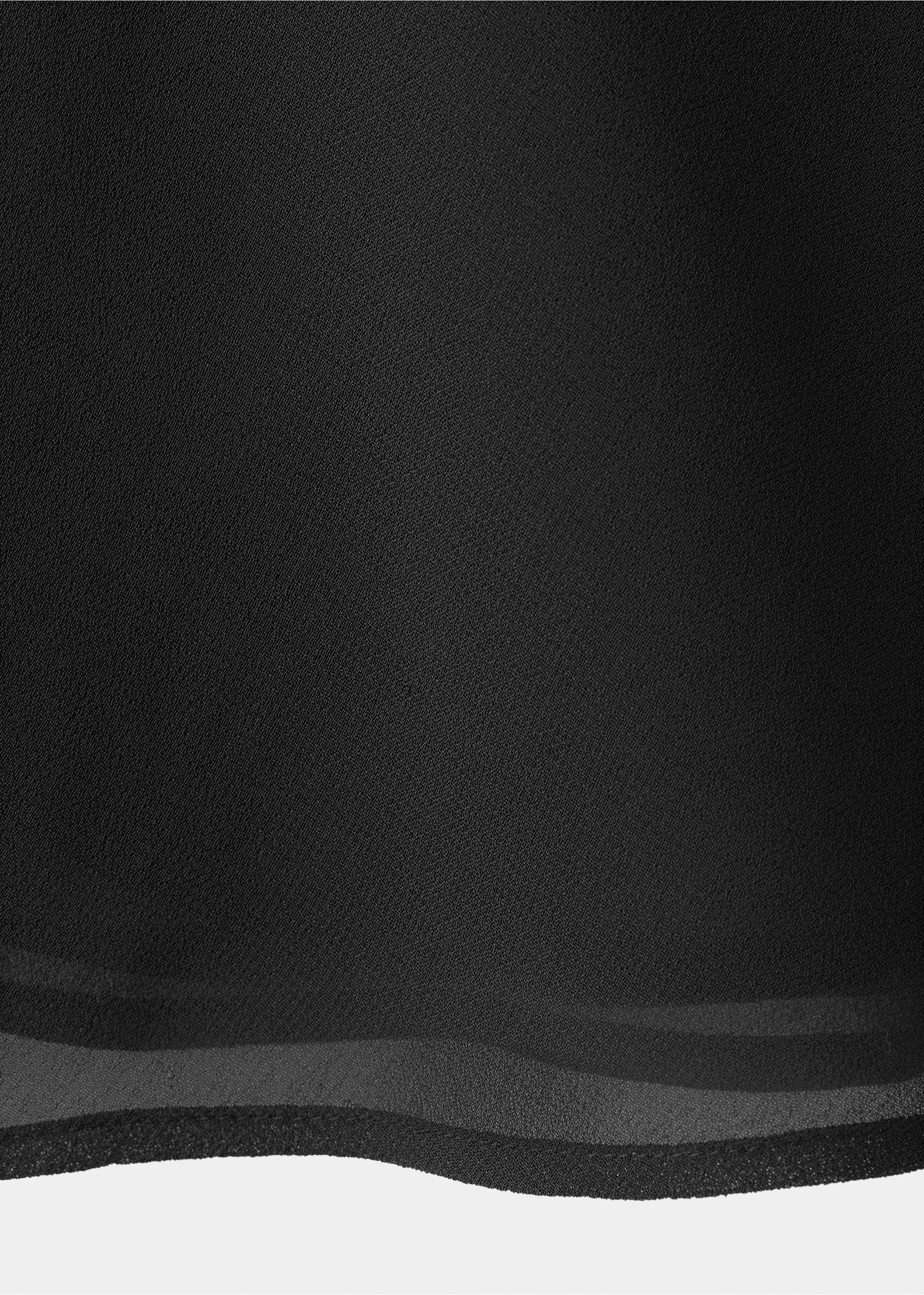 Close-up of the fine texture and fabric of a black top., Black. Ref: 37057910-00.
