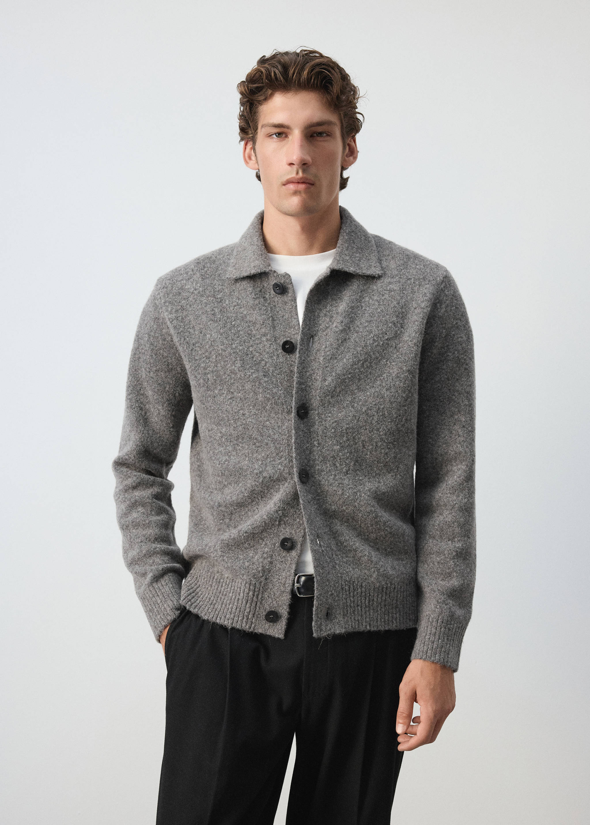 Grey knitted shirt with a classic collar and dark button fastenings.