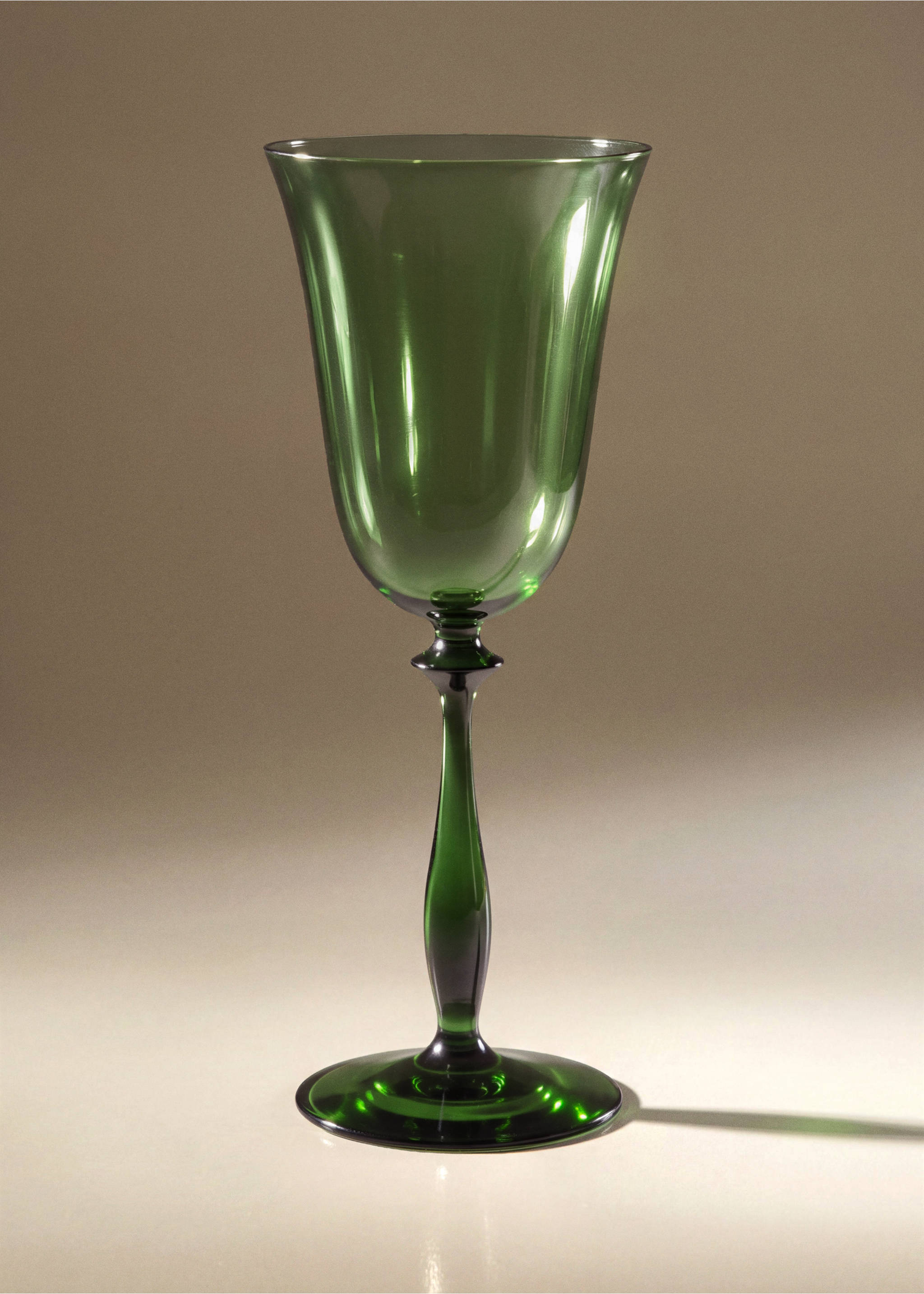 Green glass goblet with a slender stem and flared bowl., Green. Ref: 37057919-00.