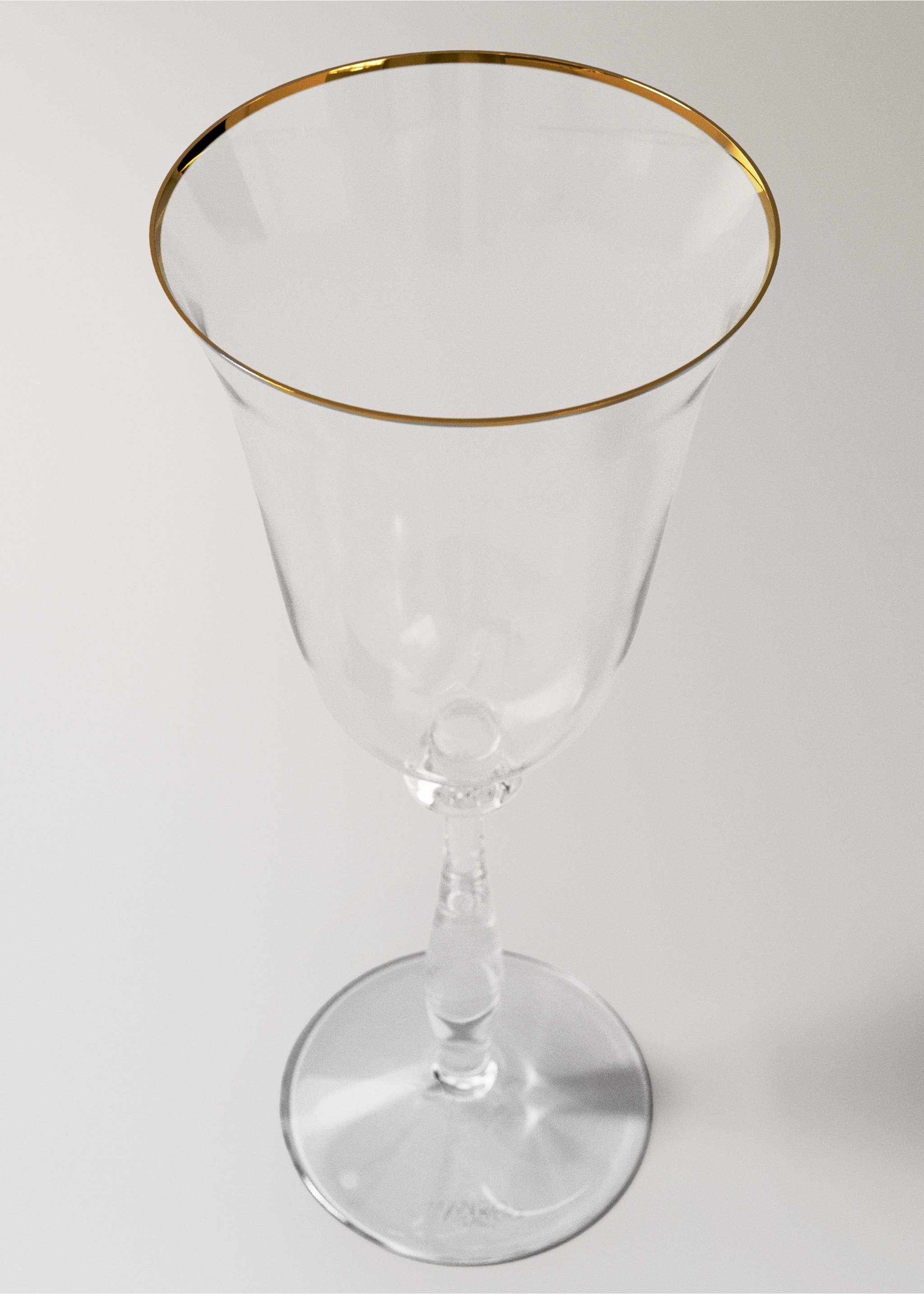 Clear glass goblet with a faceted stem and a metallic gold rim., Gold. Ref: 37057919-00.