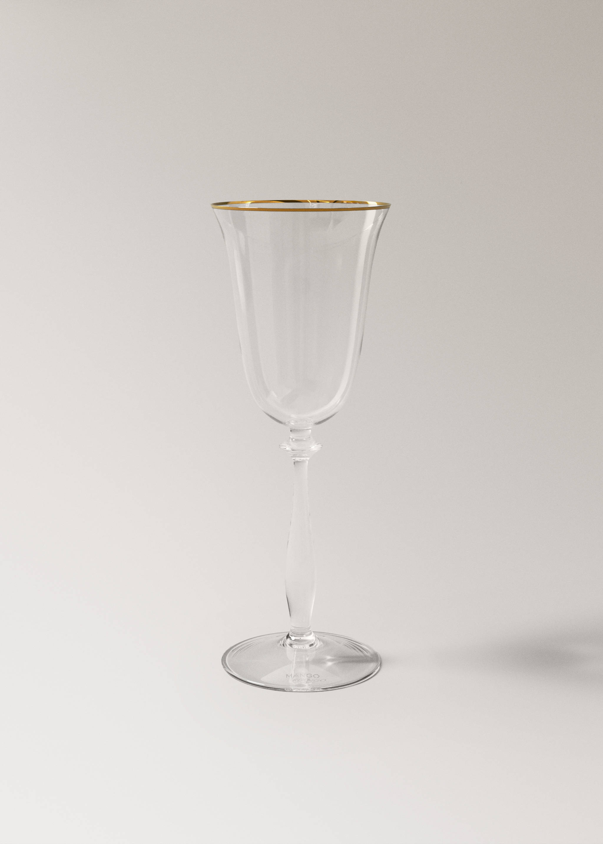 Clear glass goblet featuring a gold-trimmed rim and slender stem.