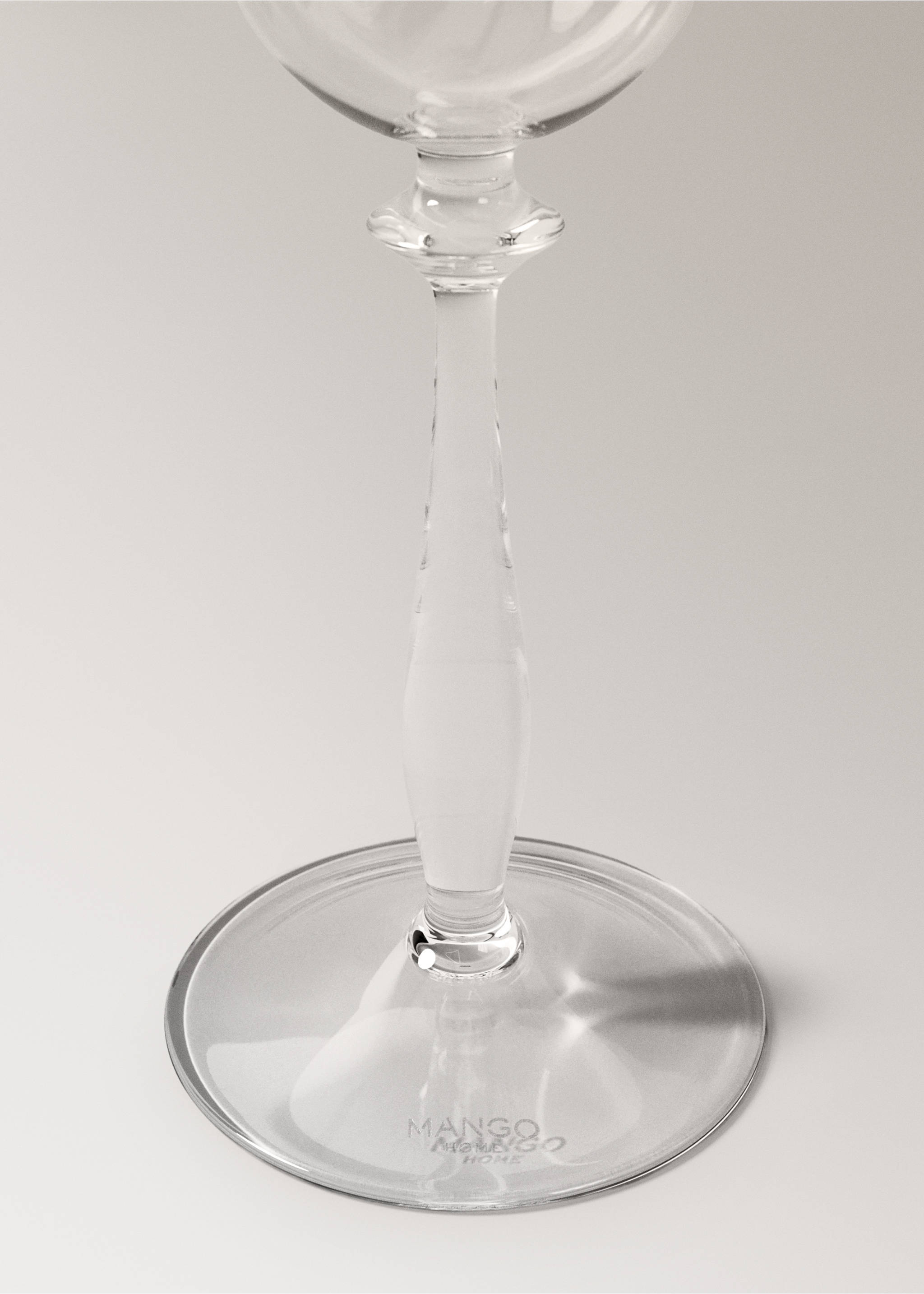 Clear glass goblet showing detail of its slender stem and wide base., Silver. Ref: 37057919-00.