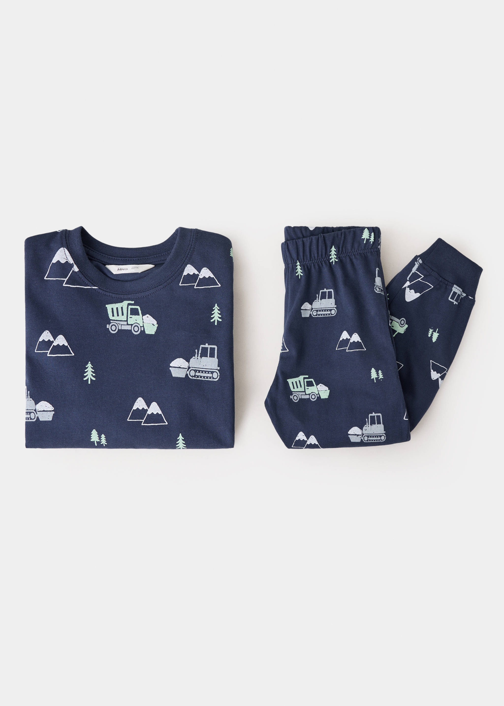 Navy blue children's pyjama set with an all-over construction vehicle and mountain print.