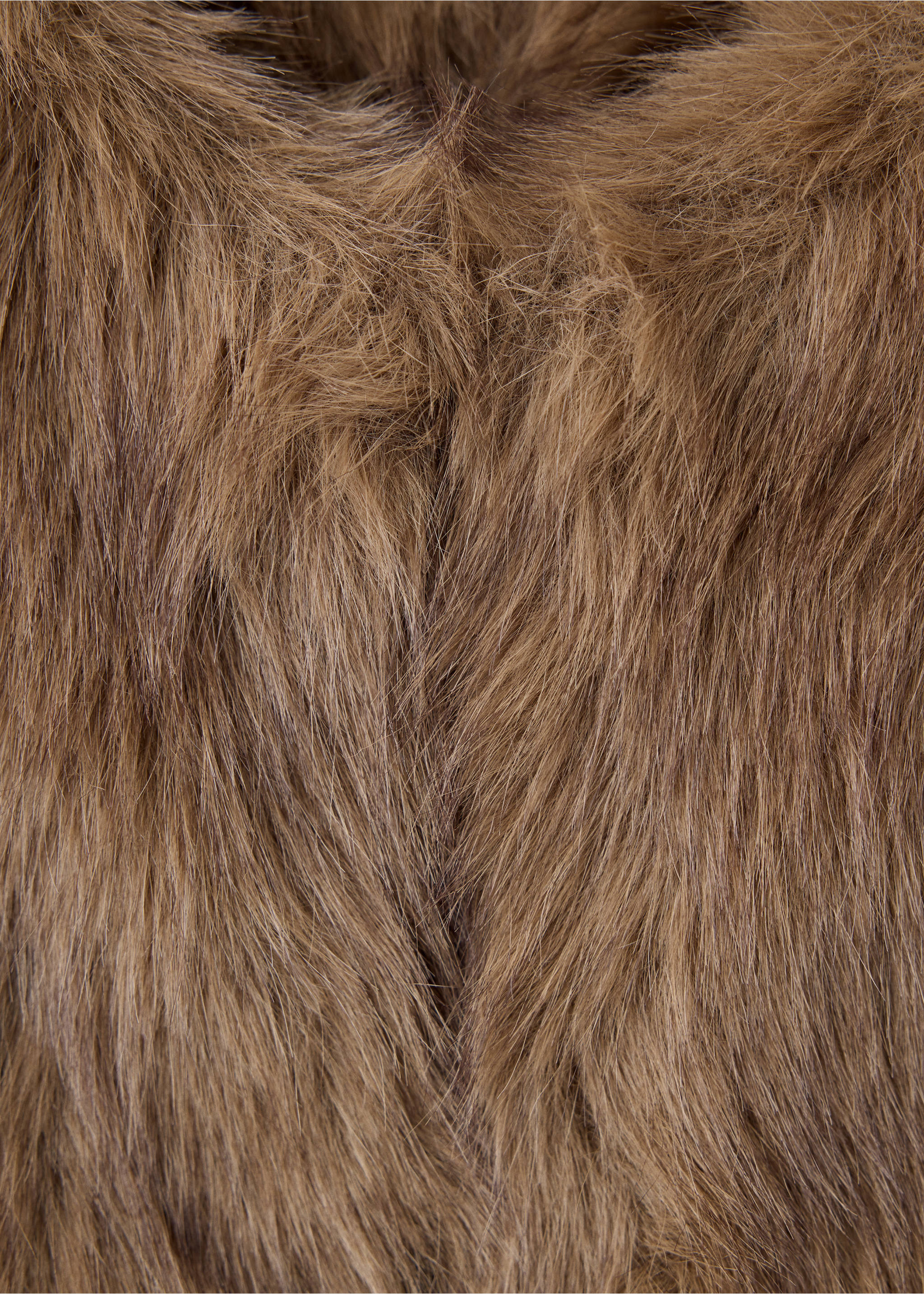 Close-up of a brown faux-fur vest showing the textured material., Beige. Ref: 37058262-00.
