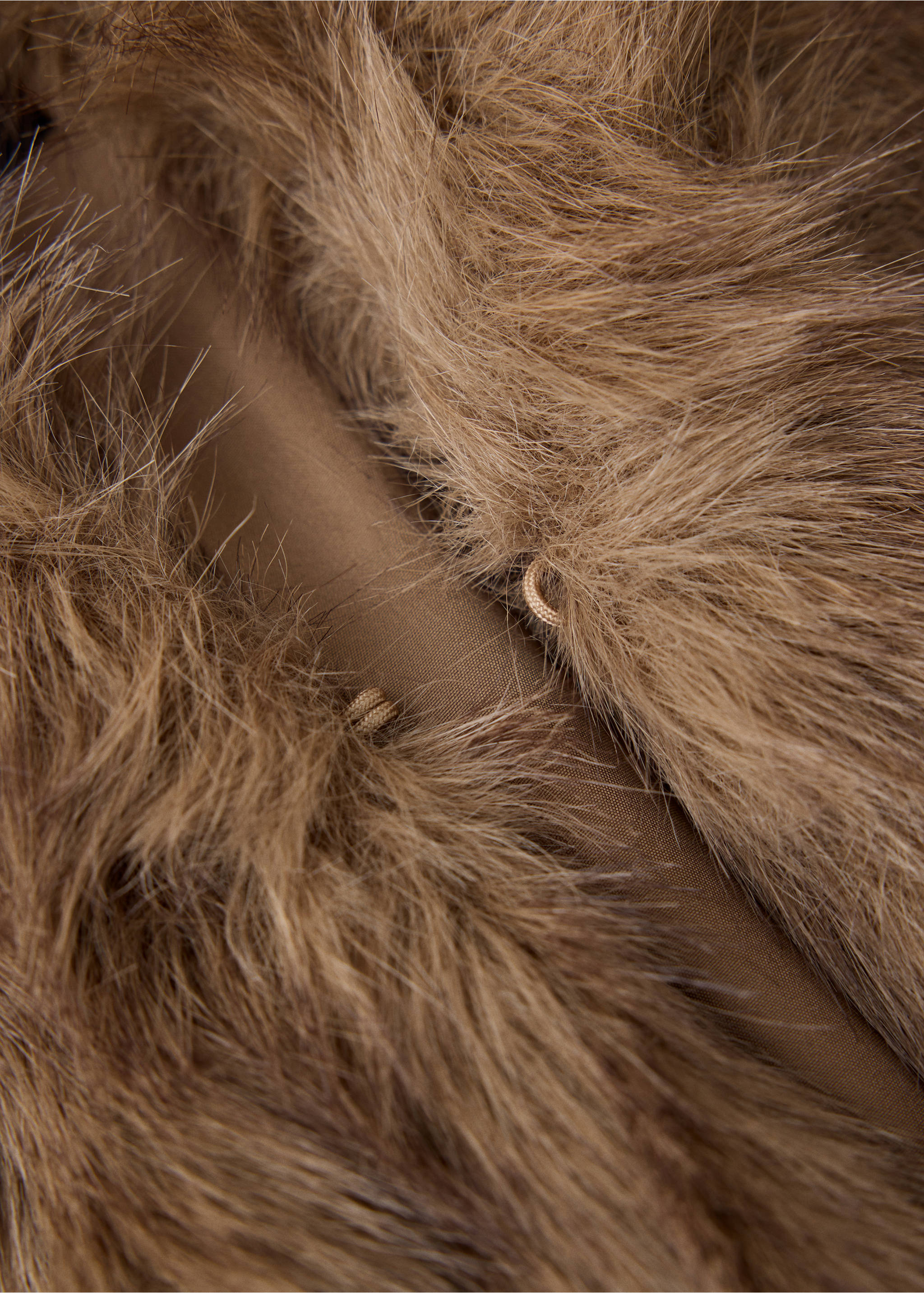 Close-up of brown faux-fur vest texture and closure detail., Beige. Ref: 37058262-00.