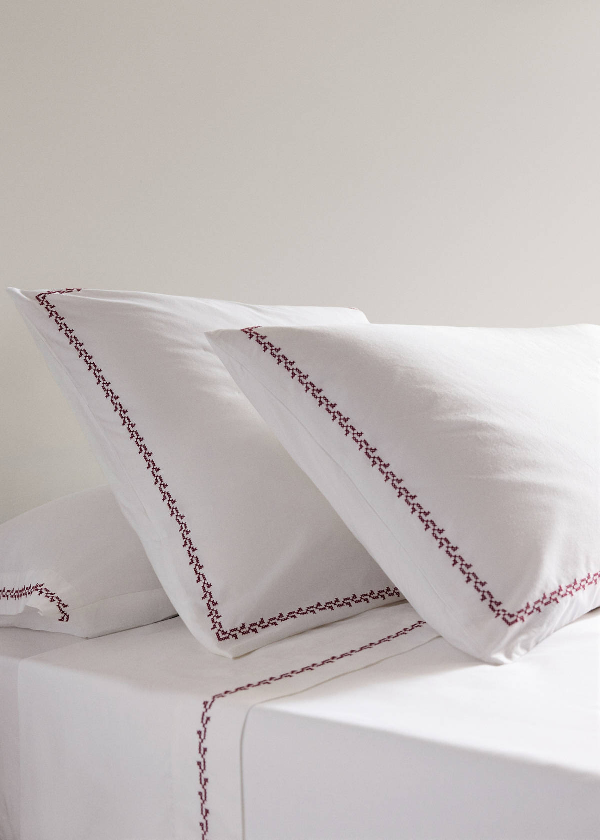 Two cotton pillowcases with embroidered detailing, 60 x 60 cm — Red