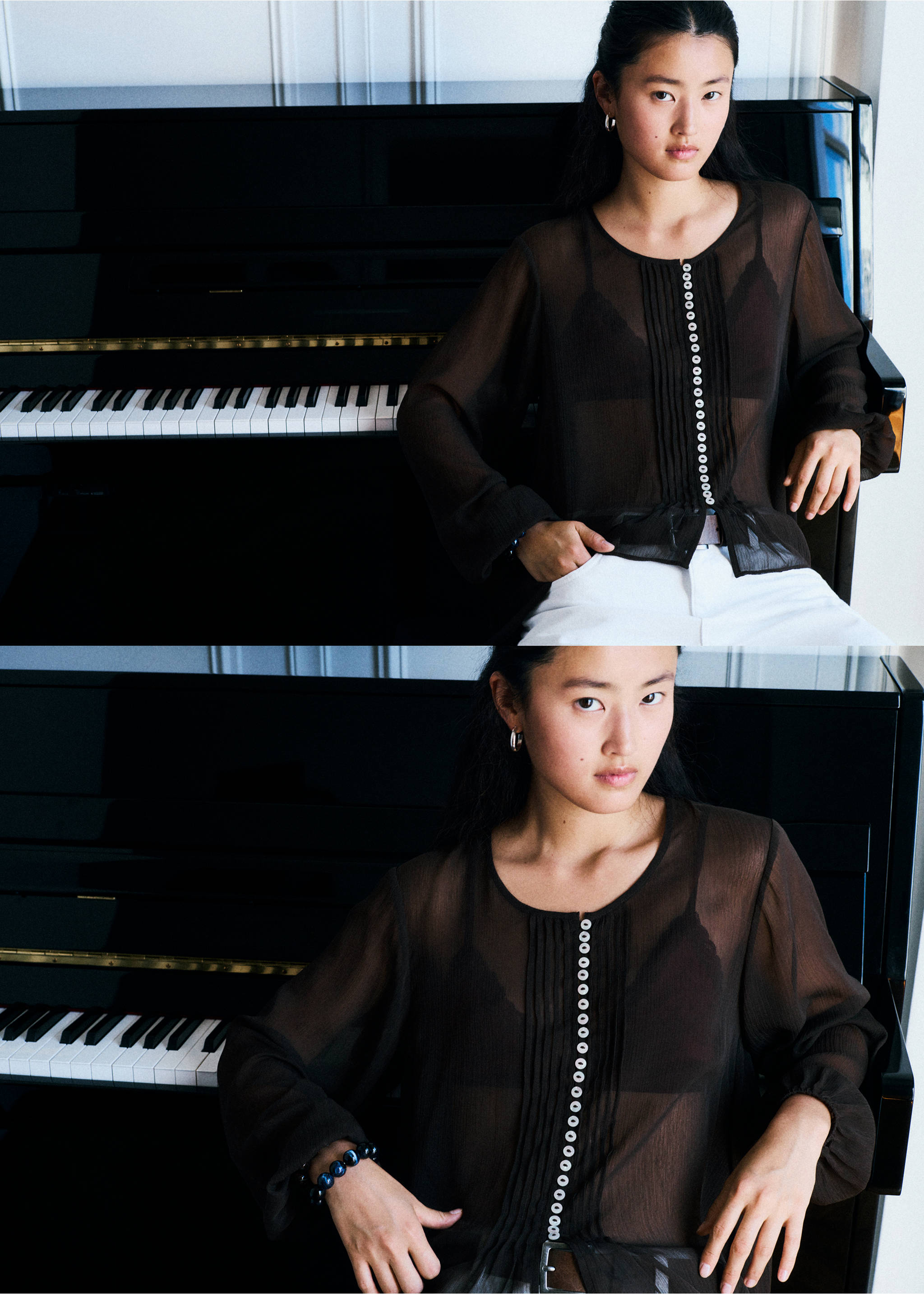 Close-up of a model wearing a dark brown sheer long-sleeved blouse with a button placket in front of a piano., Brown. Ref: 37058273-00.