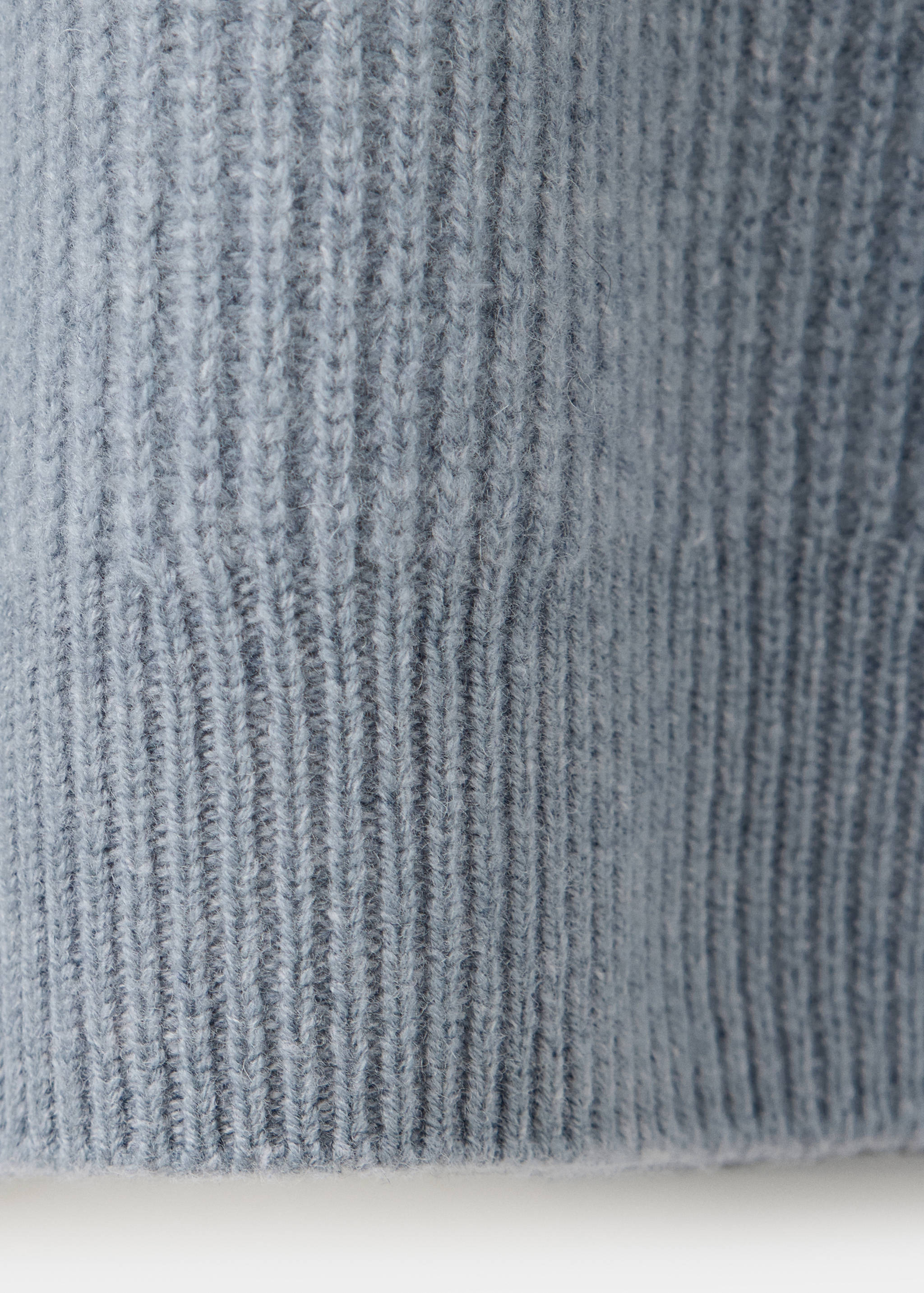 Close-up of a light blue men's jersey showing the soft ribbed knit texture.