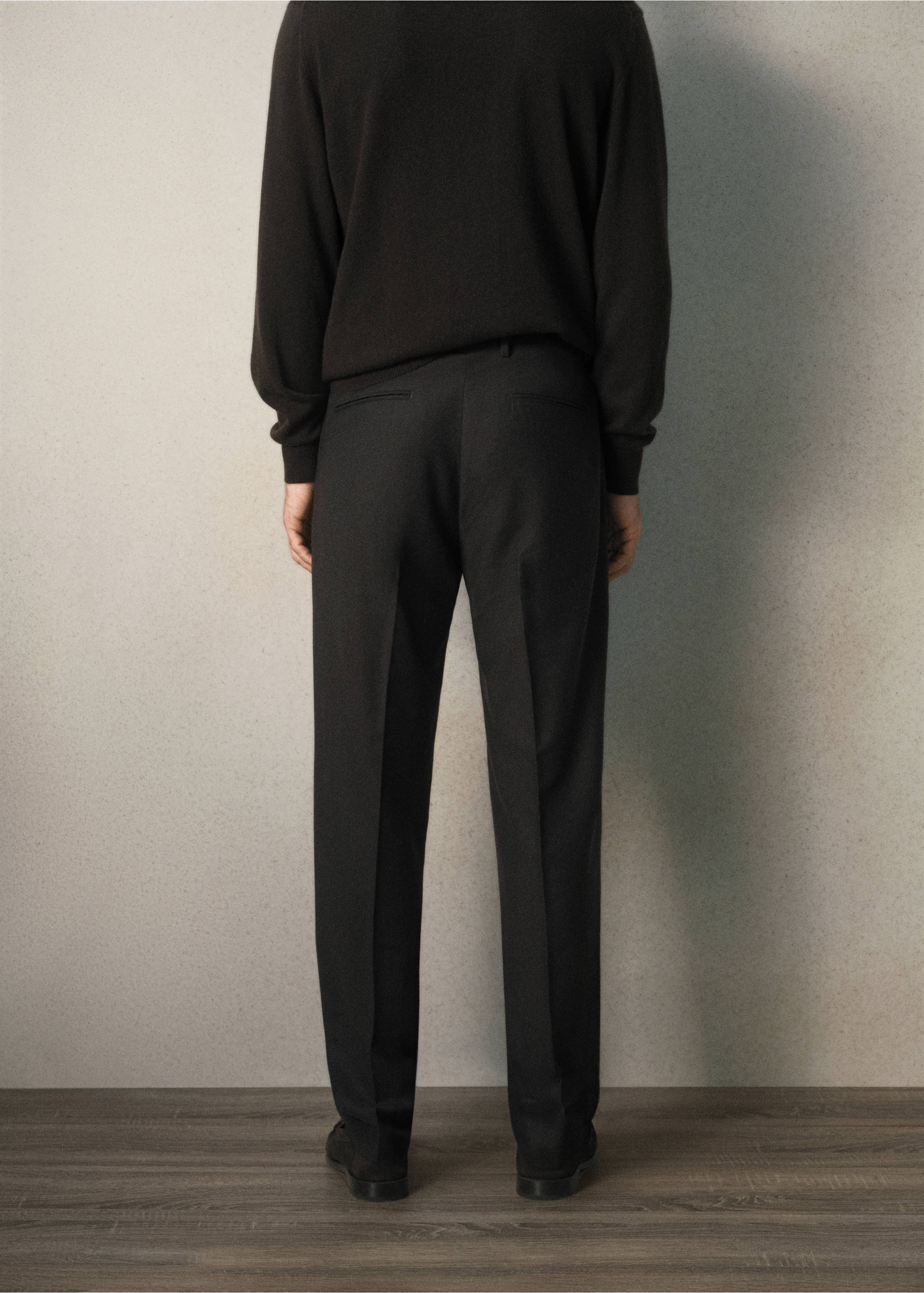 Back view of dark trousers with pressed creases worn with a black sweater., Brown. Ref: 37058630-00.