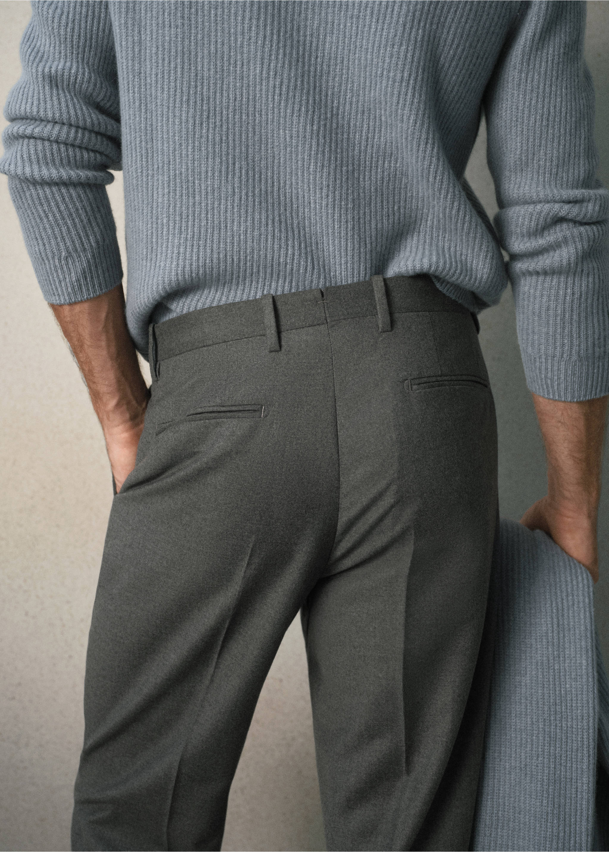 Dark grey trousers with belt loops, shown from the back with a blue jumper., Light Heather Grey. Ref: 37058630-00.