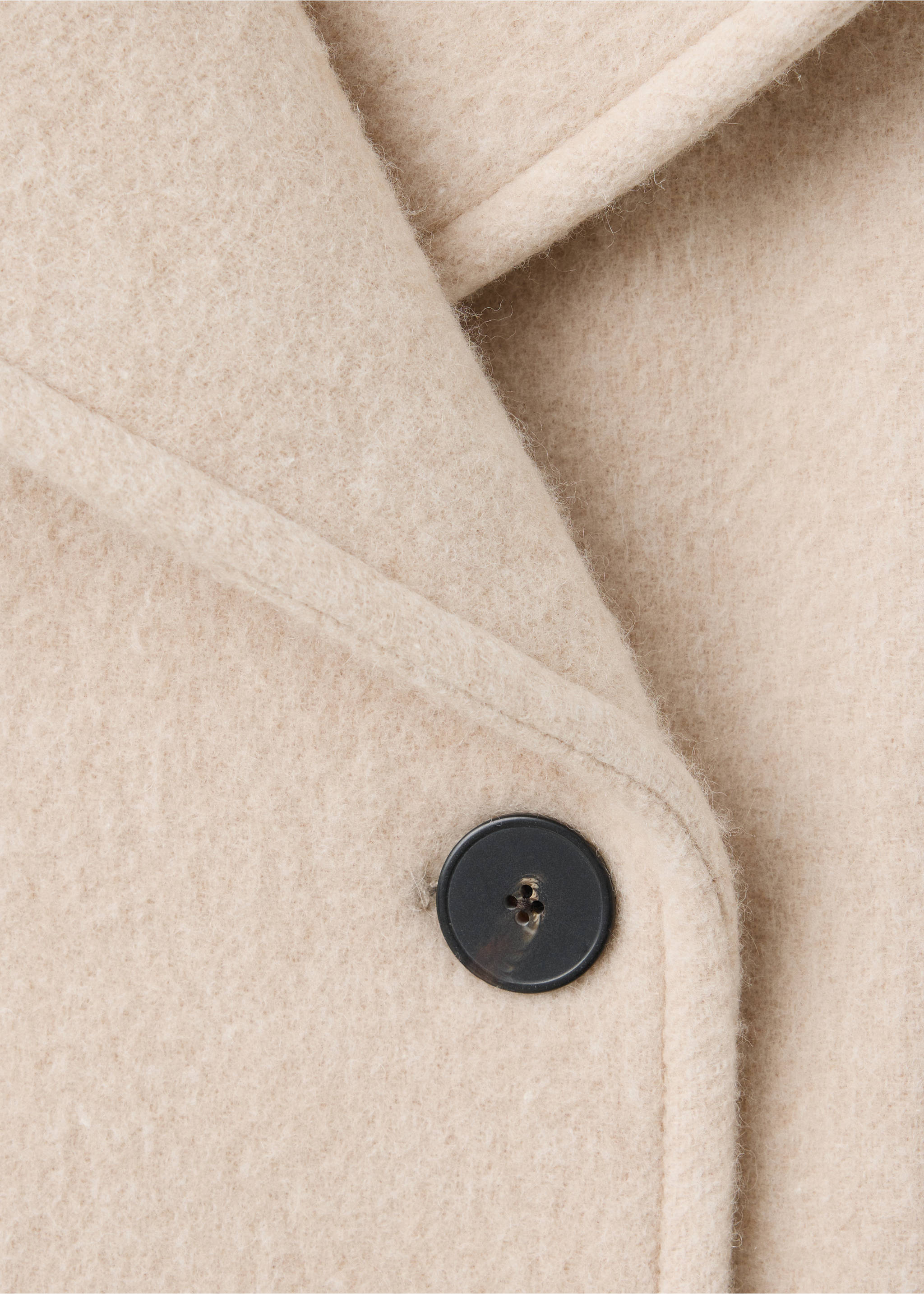 Close-up of a beige jacket showing the lapel and button detail., Beige. Ref: 37058640-00.