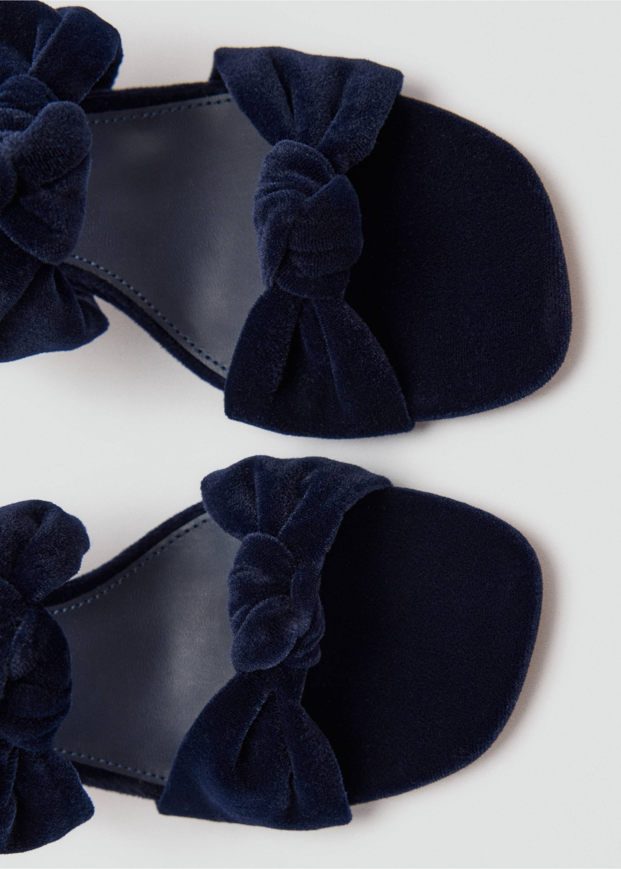 Close-up of dark navy blue velvet sandals with front knot detail and square toes., Night Blue. Ref: 37059113-00.