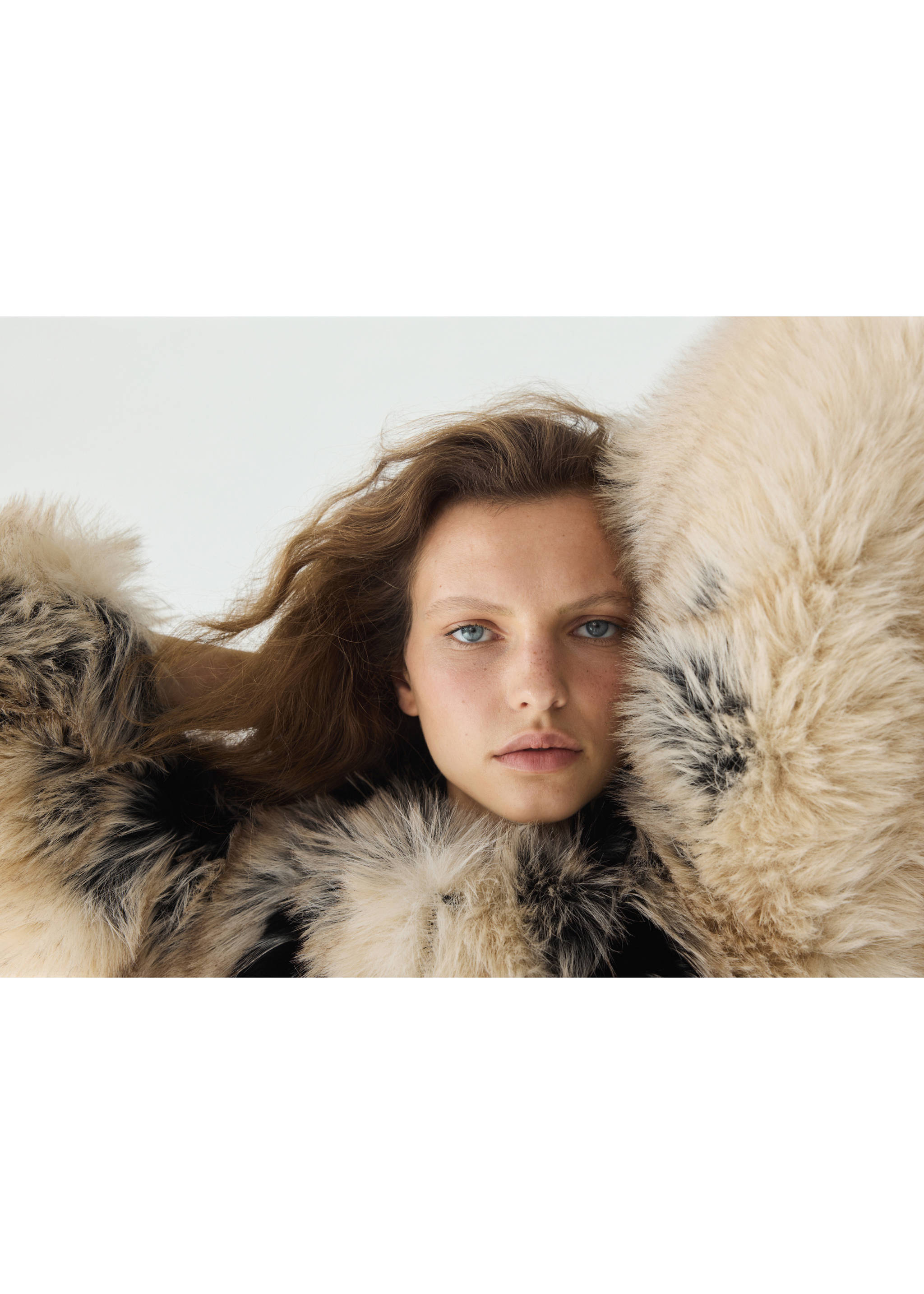 Close-up of a voluminous cream and black faux-fur jacket., Black. Ref: 37059114-00.