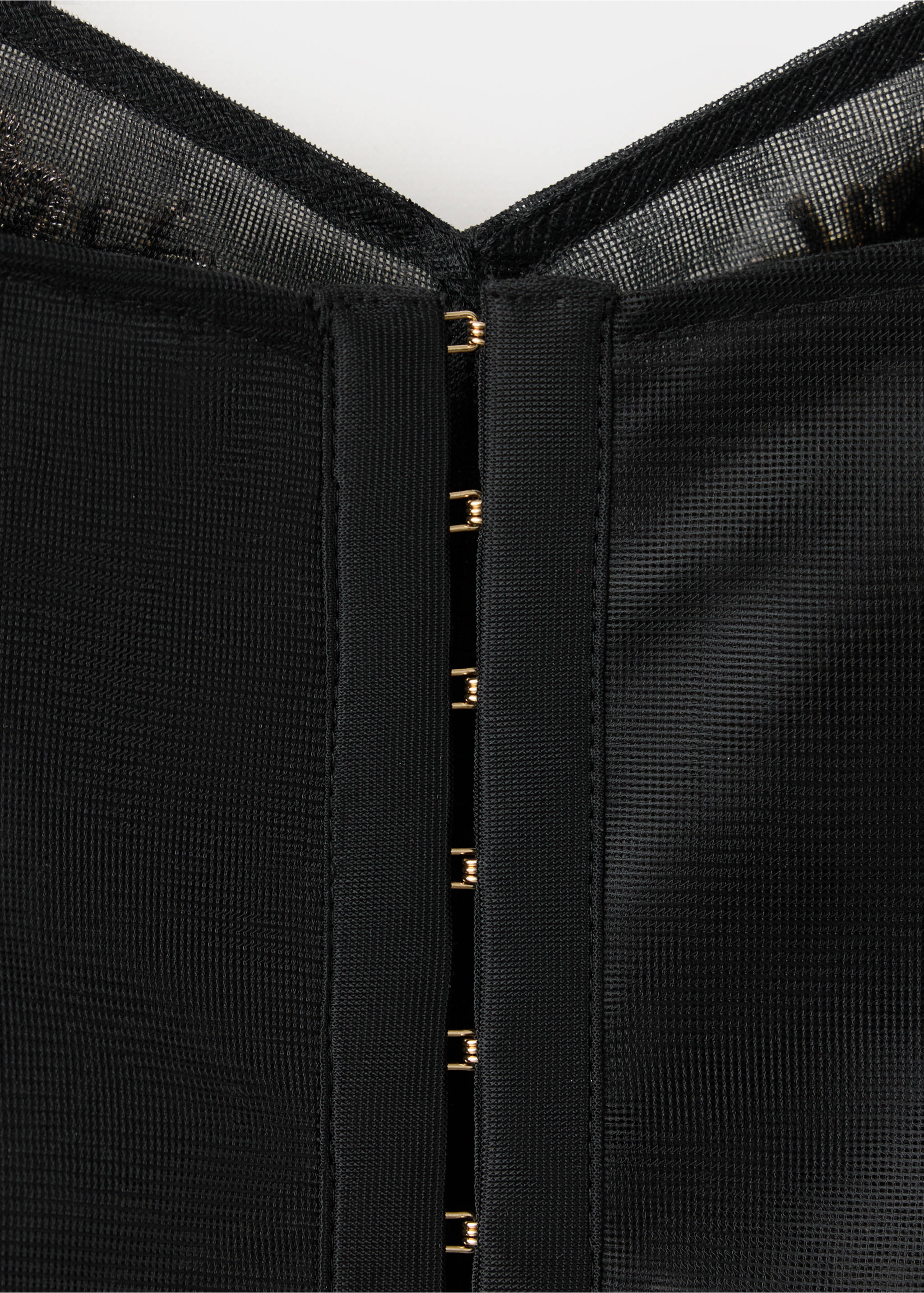 Close-up of a black mesh top with gold-toned hook-and-eye fastenings., Black. Ref: 37059118-00.