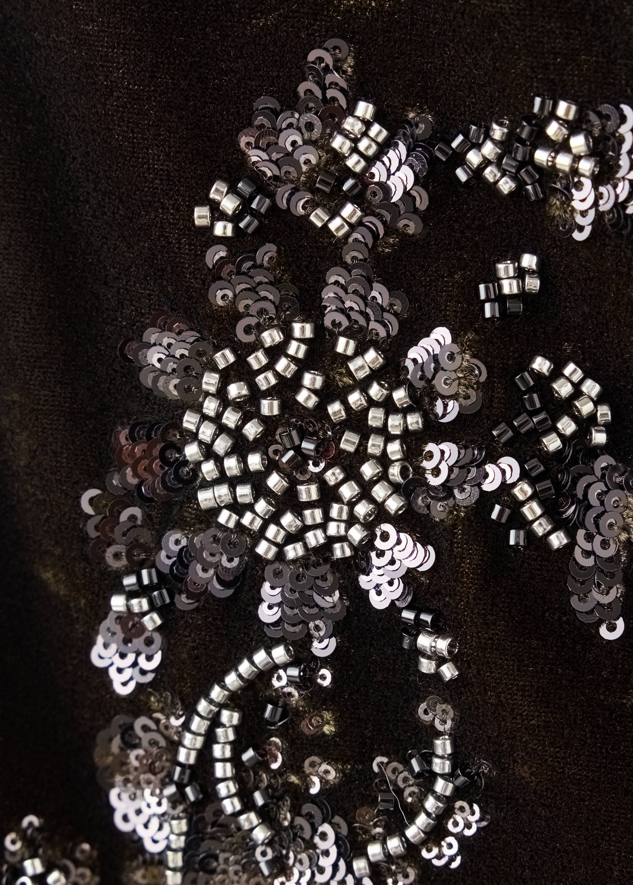 Close-up of beaded and sequined shorts embellishment.