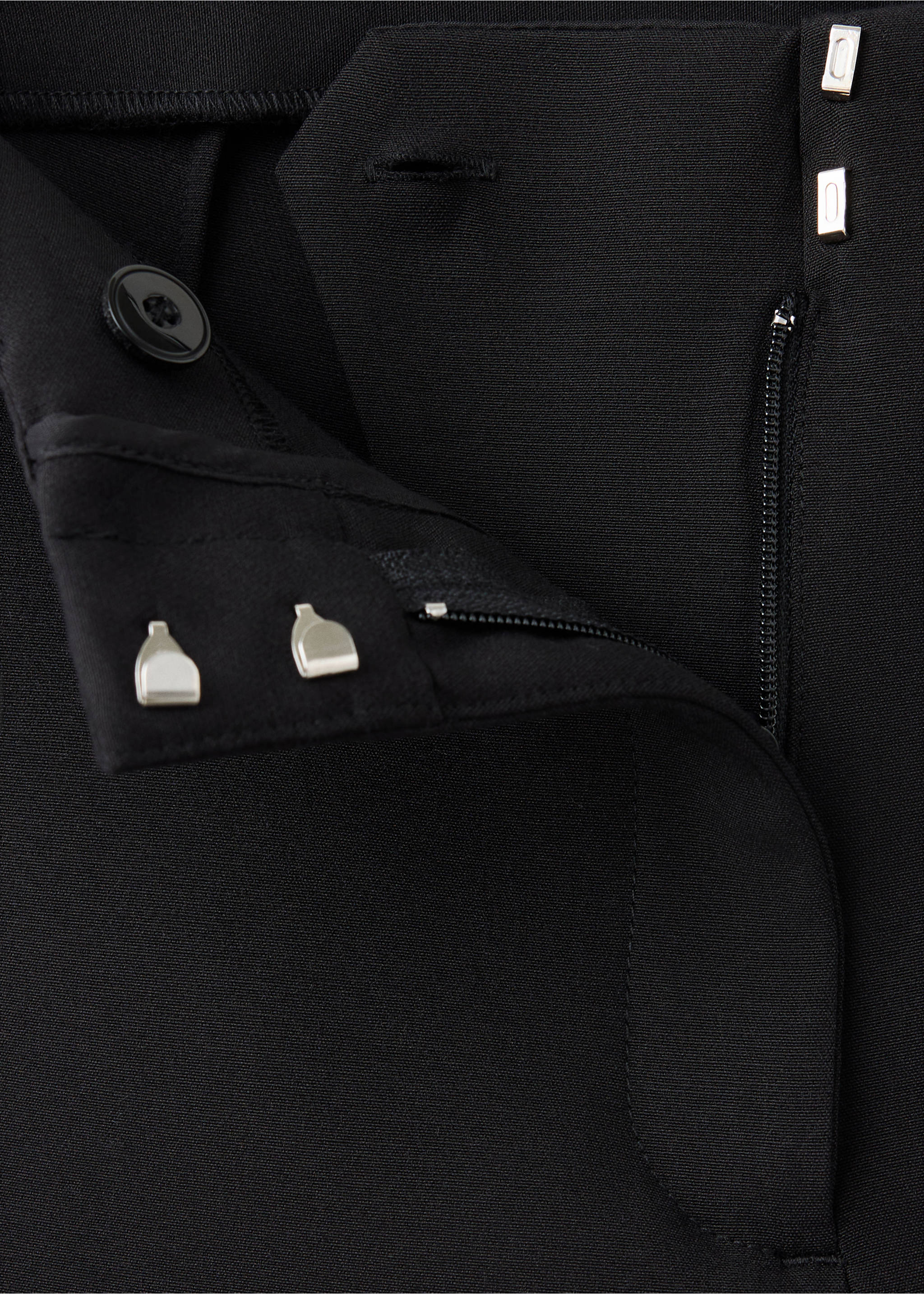 Close-up of black trousers waistband with hook-and-eye and button fastening., Black. Ref: 37059128-00.