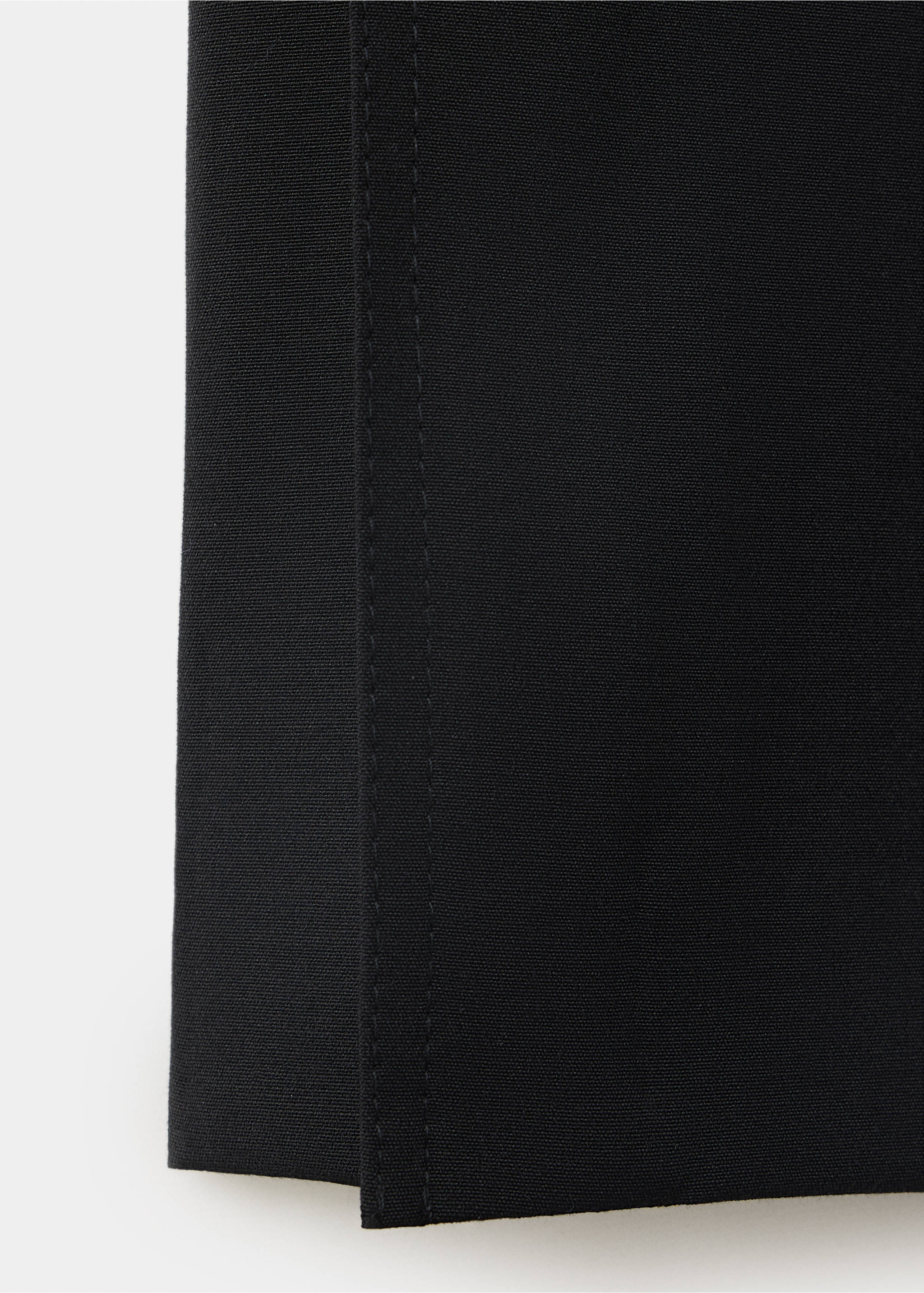 Close-up of black trousers fabric texture and seam detail., Black. Ref: 37059128-00.