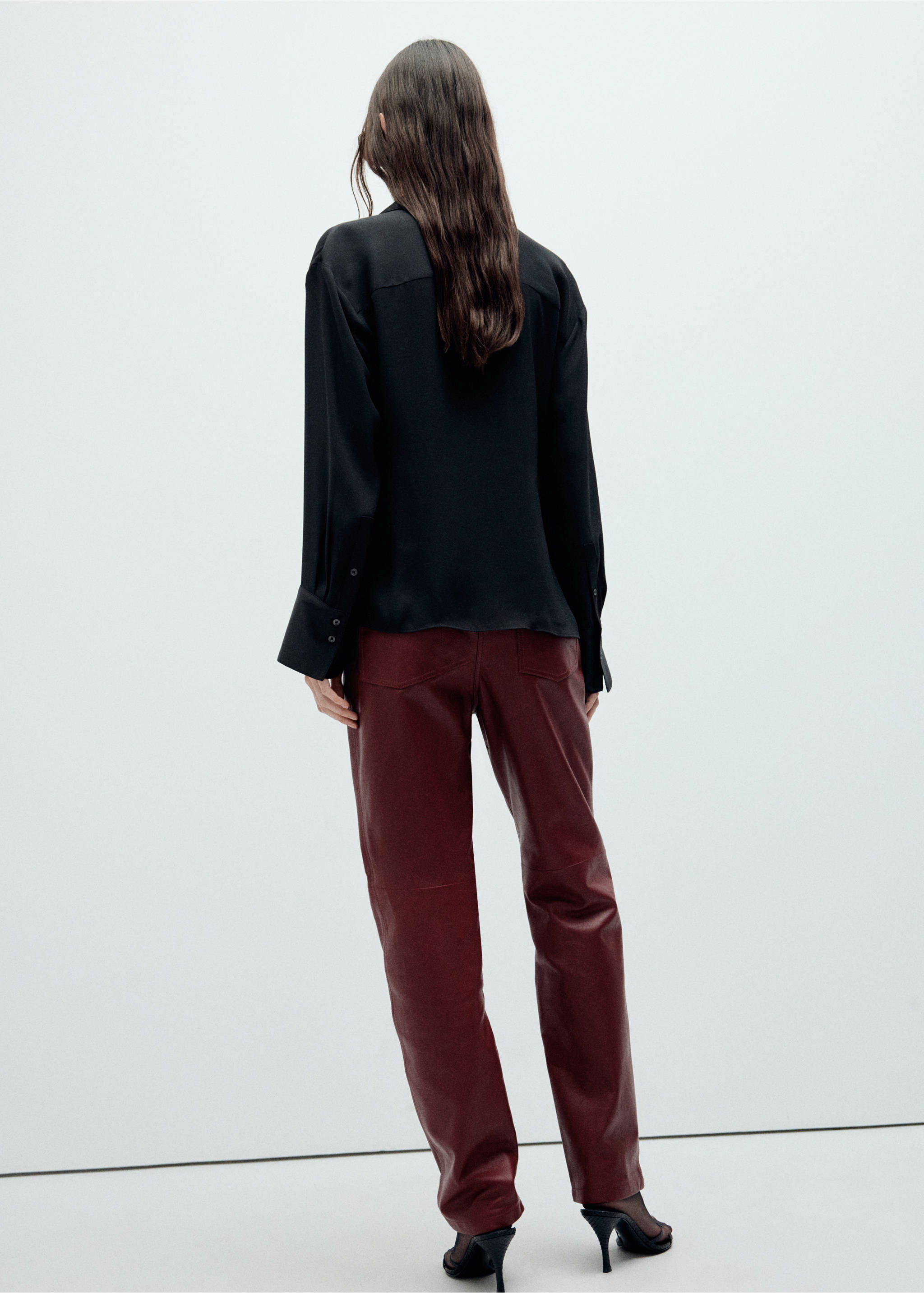 Black shirt viewed from the back, featuring long sleeves with wide cuffs., Black. Ref: 37059129-00.