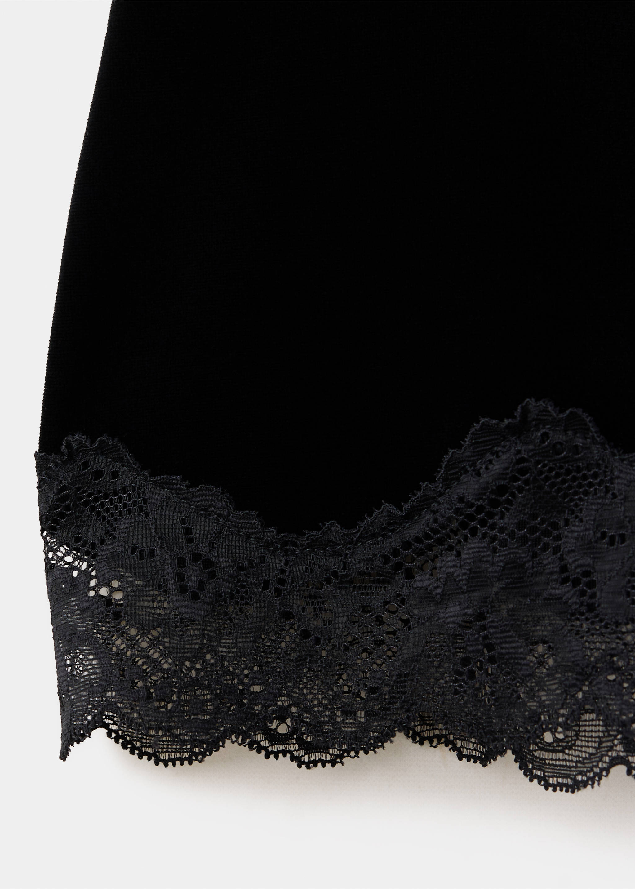 Close-up of a black skirt with a scalloped lace hem., Black. Ref: 37059132-00.