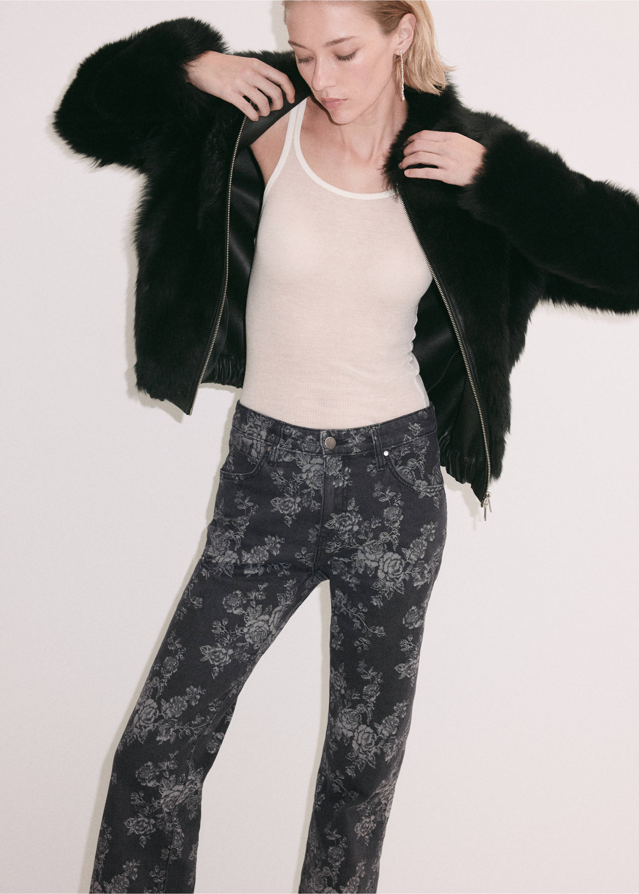 Dark grey floral print denim trousers worn with a white tank top., Denim Grey. Ref: 37059134-00.