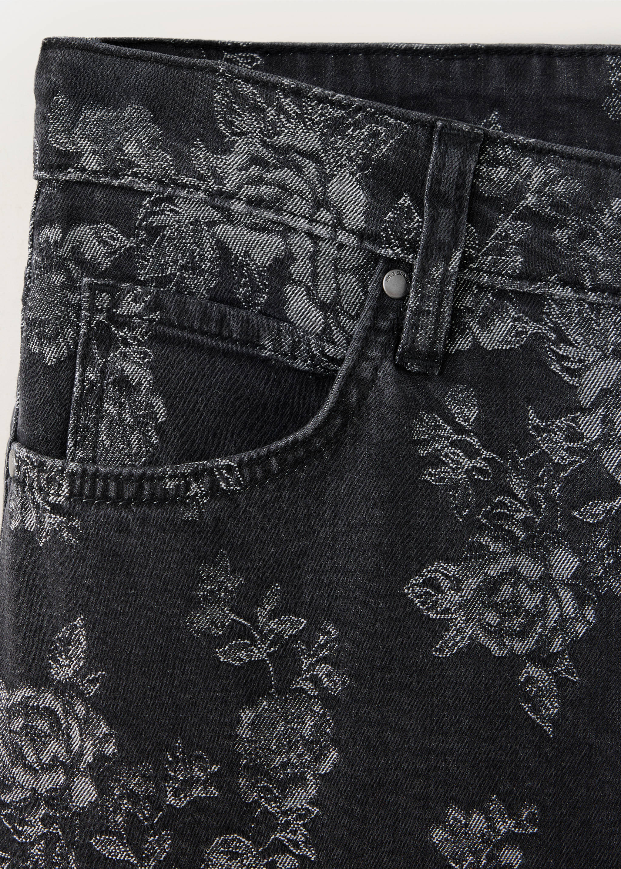 Close-up of black denim trousers featuring a silvery floral pattern., Denim Grey. Ref: 37059134-00.