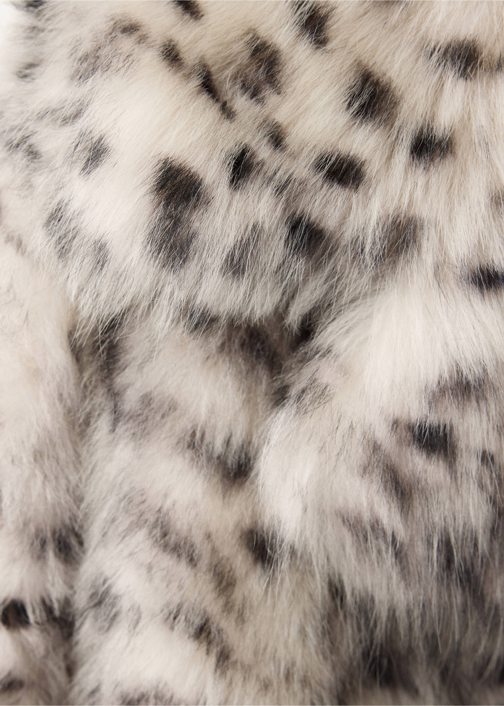 Close-up of a spotty faux-fur coat texture., Ivory White. Ref: 37059142-00.
