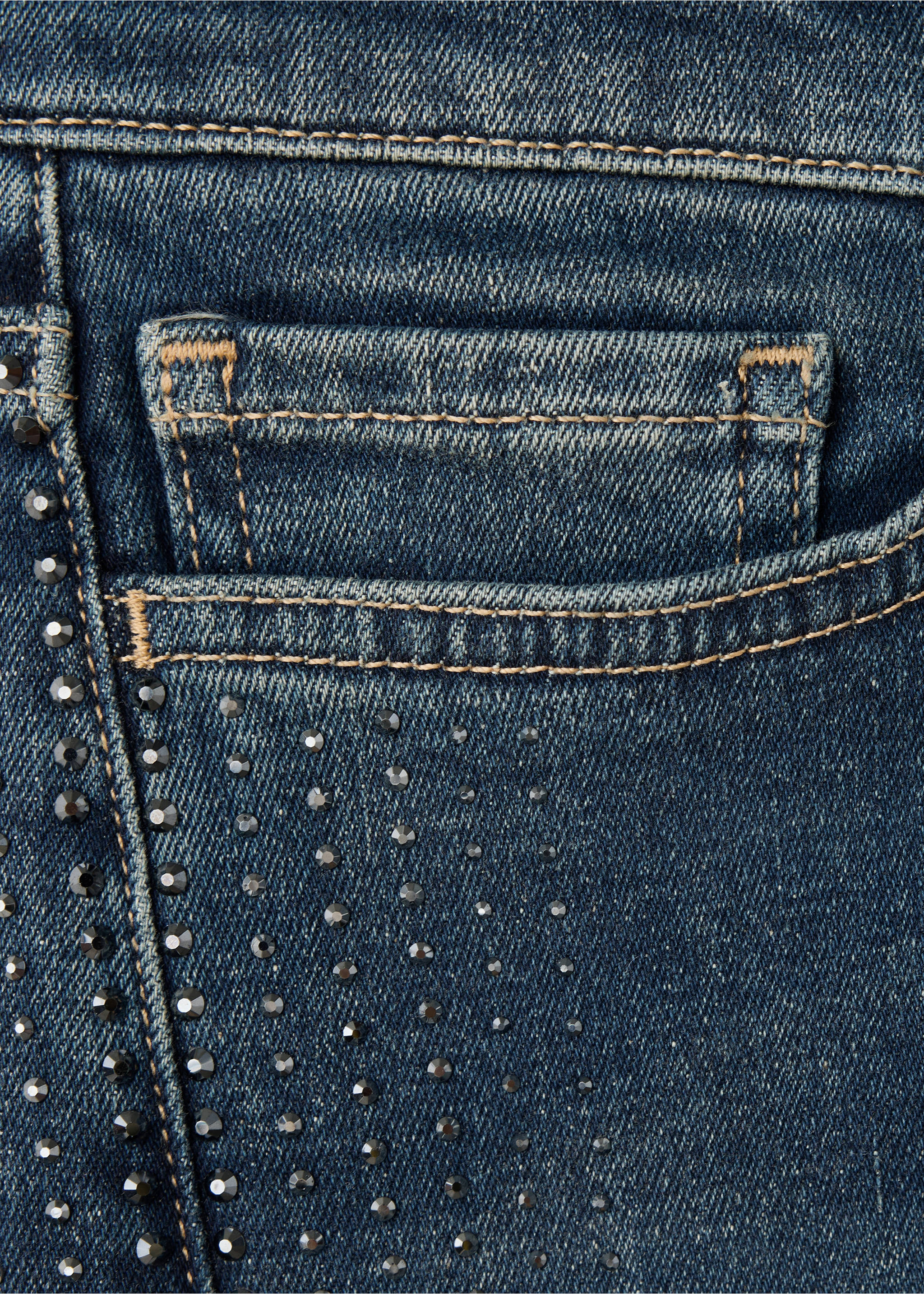 Close-up of blue denim trousers with rhinestones and contrast stitching., Dark Blue. Ref: 37059144-00.