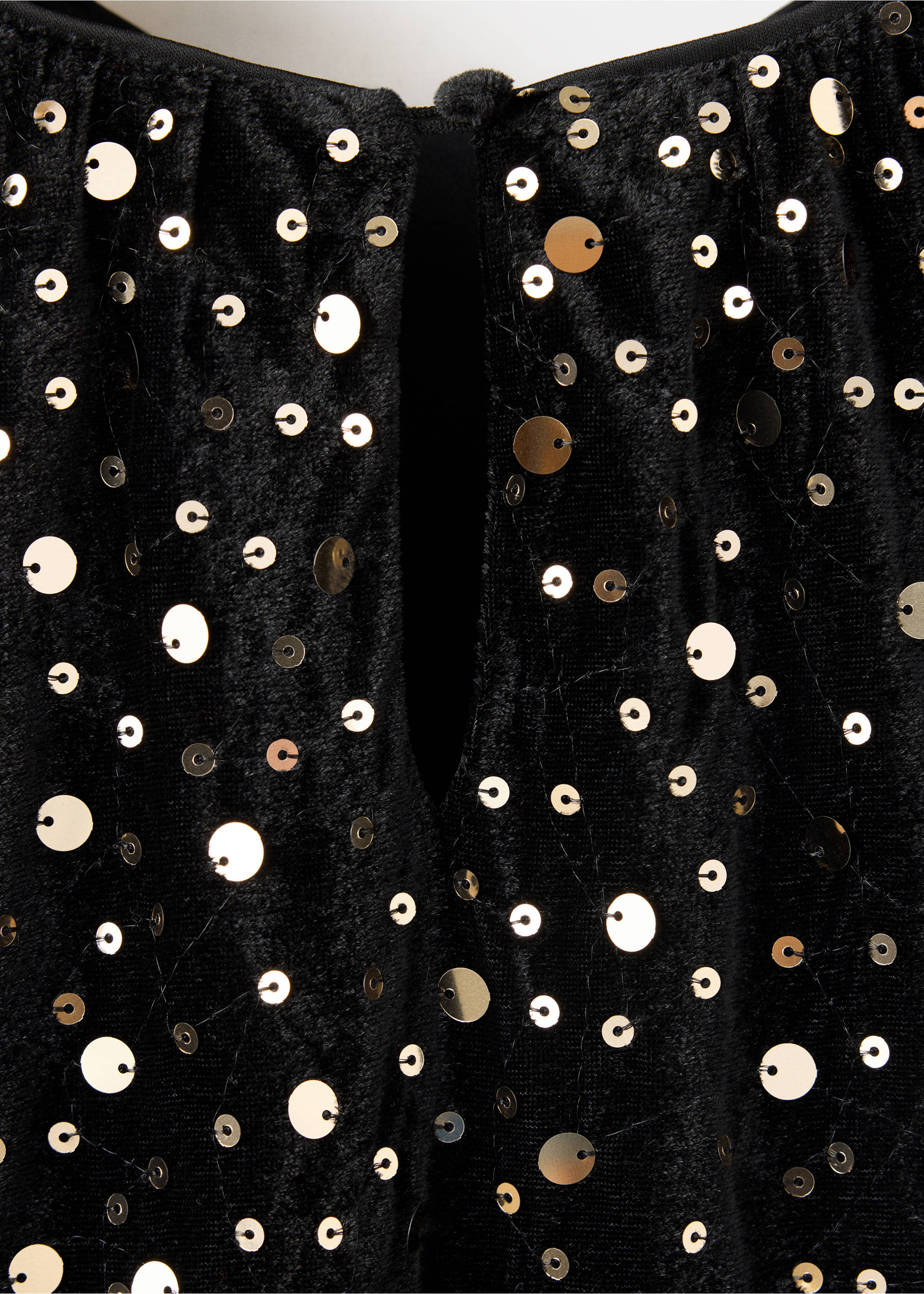 Close-up of a black sequinned kids dress showing the fabric texture and keyhole neckline., Black. Ref: 37059208-00.