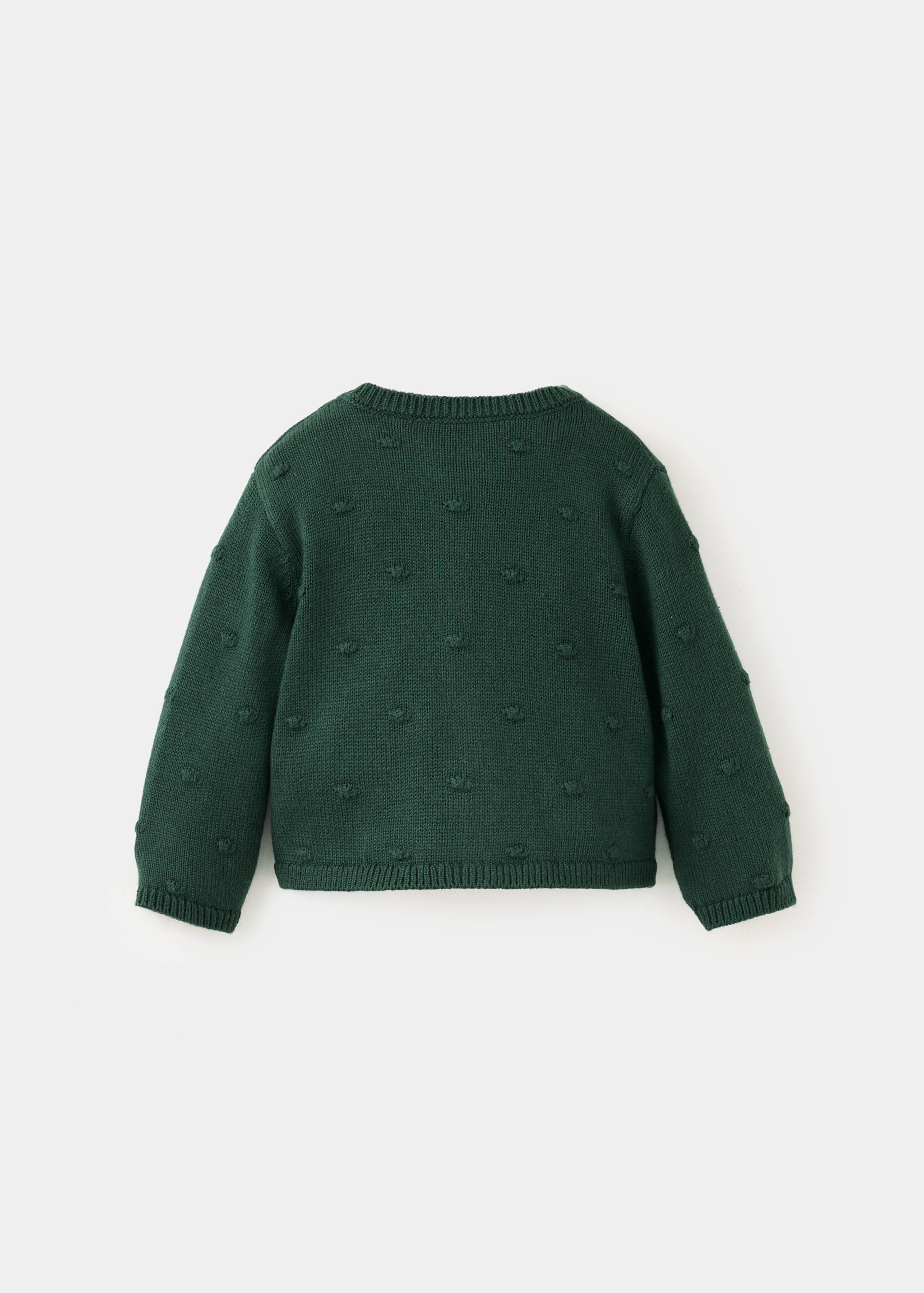 Dark green knitted children's cardigan shown from the back with textured tufted dots.