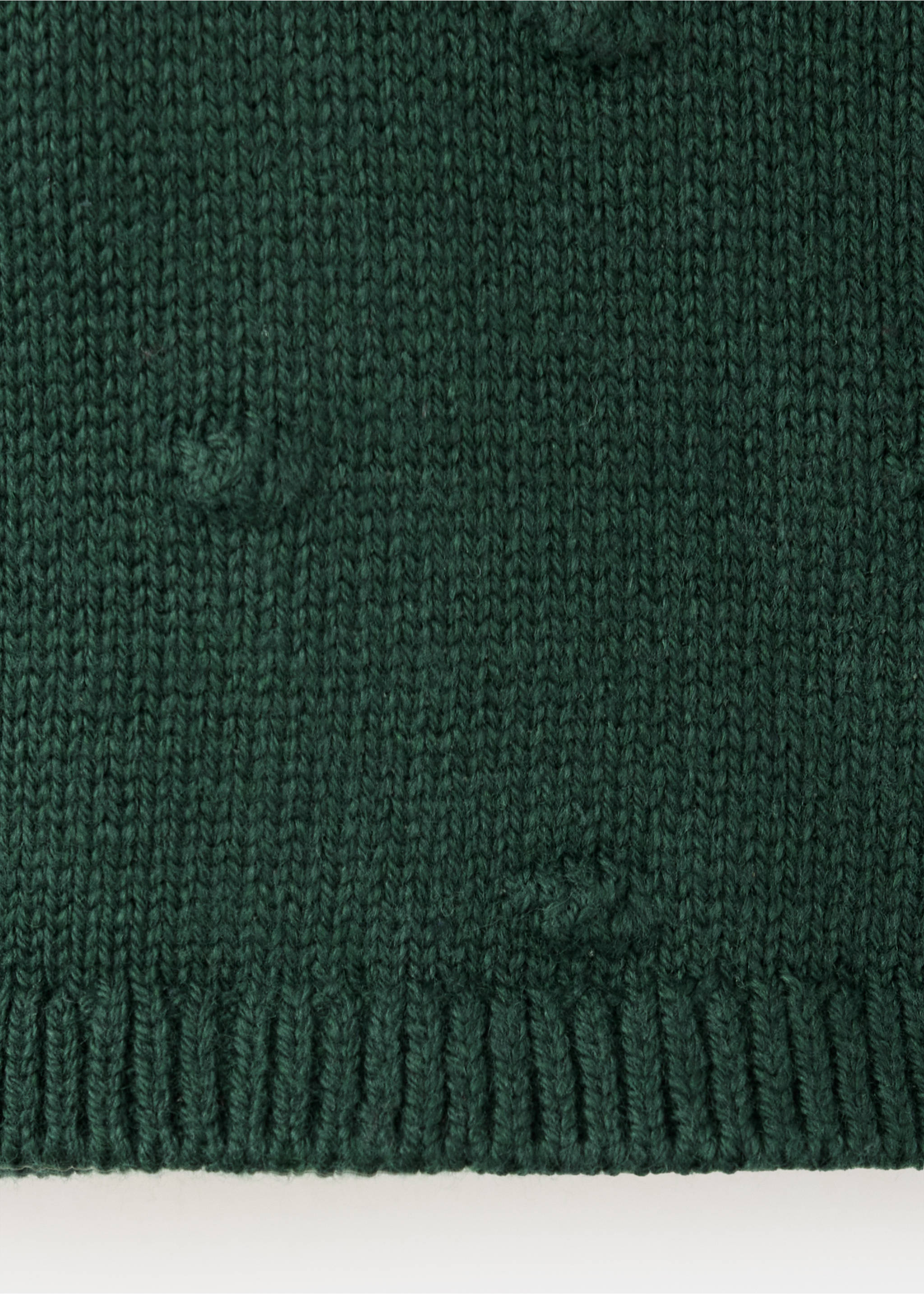 Dark green cardigan fabric close-up showing textured knit and bobbles., Green. Ref: 37059216-00.