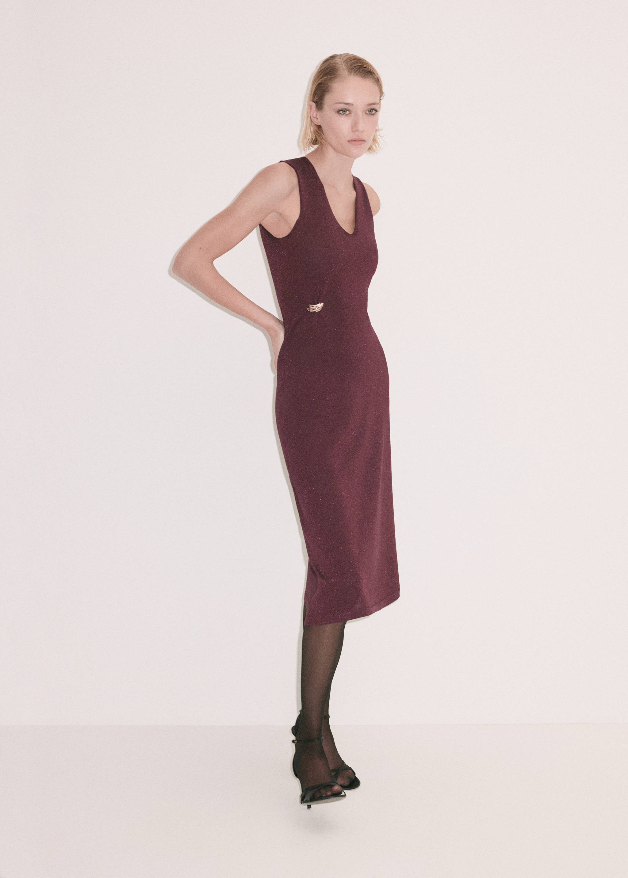 Burgundy sleeveless midi dress with scoop neck and gold waist buckle.